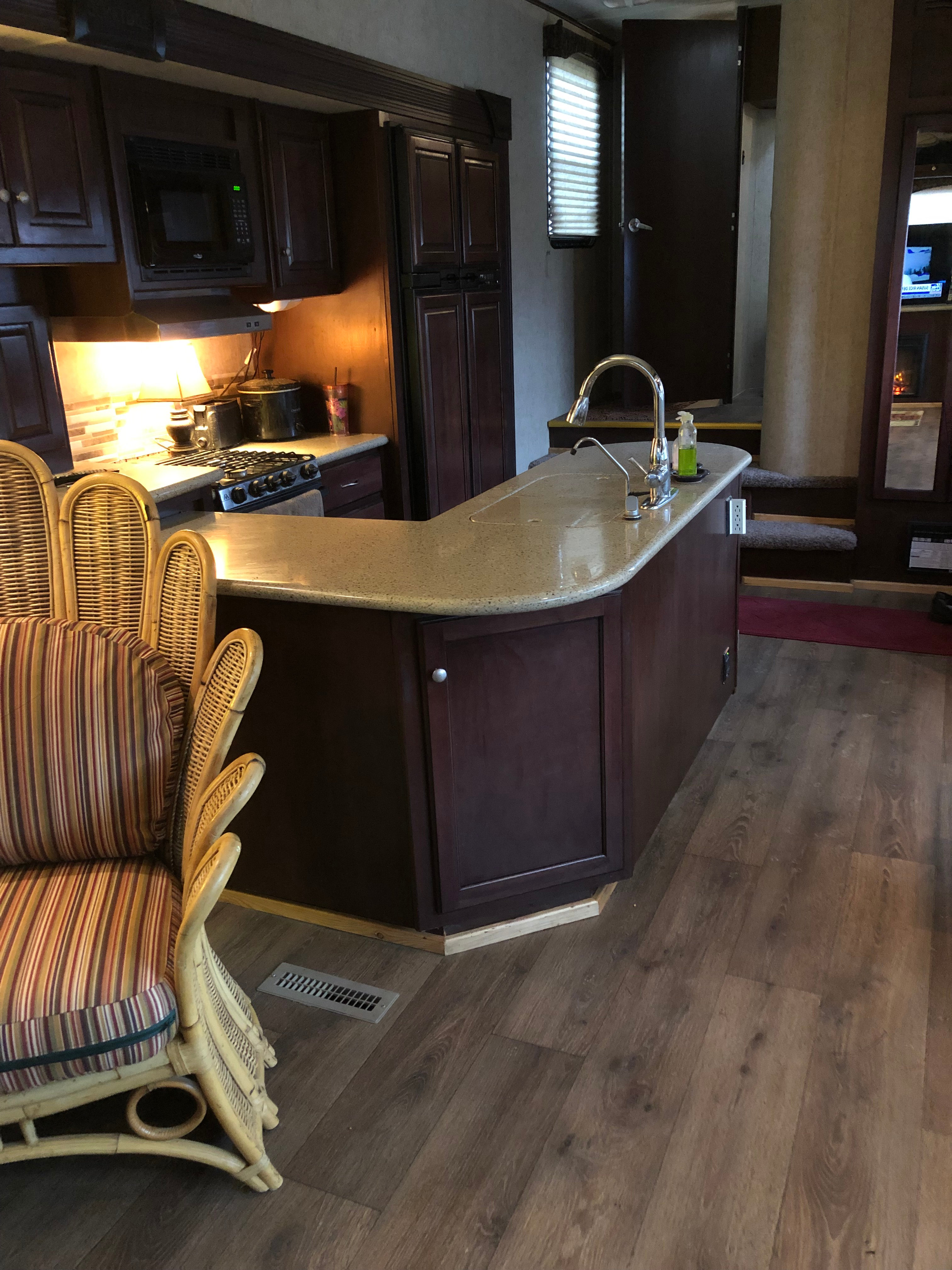 We have a nice kitchen with a double refrigerator. 