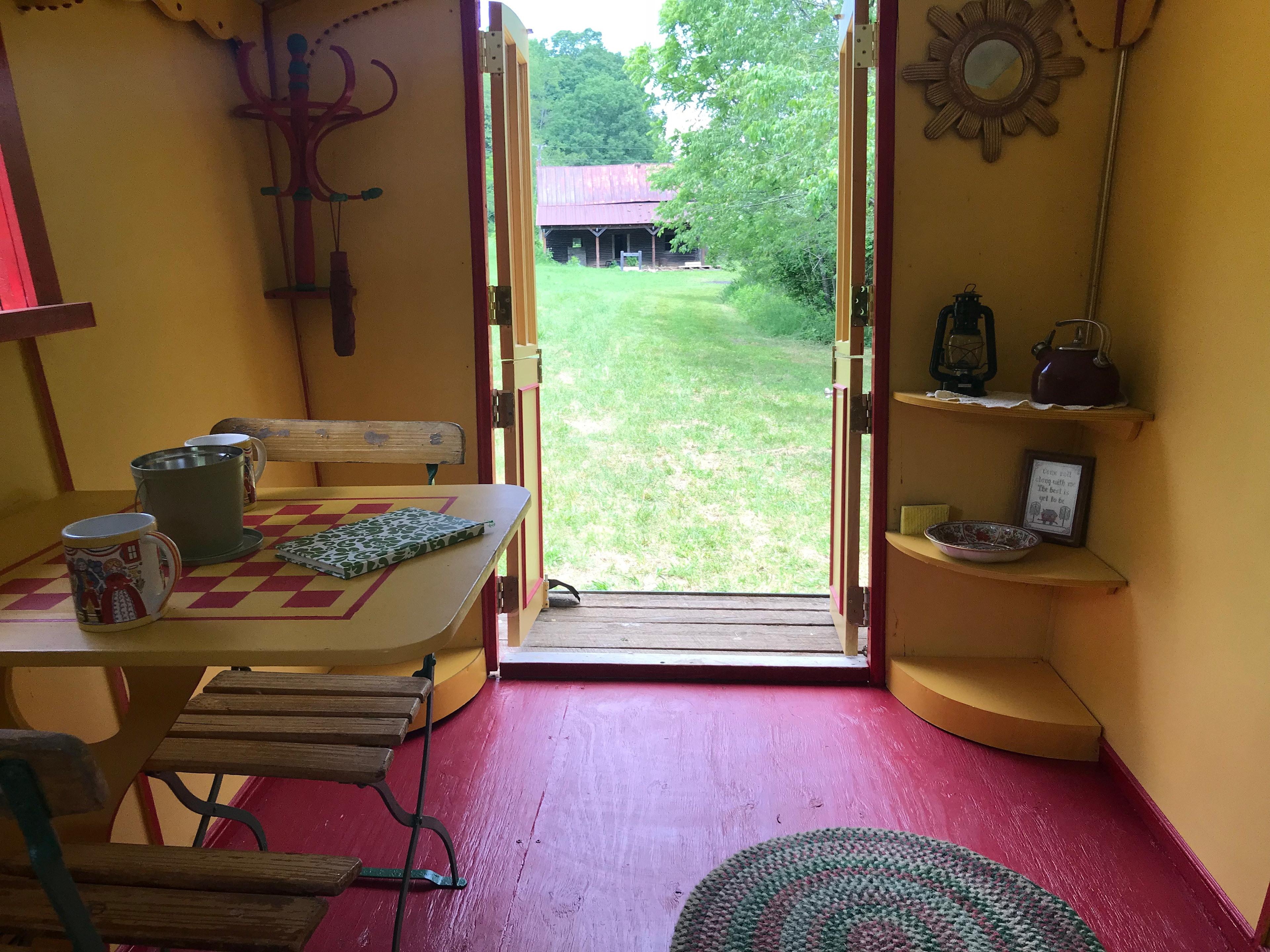 The Lee Gypsy Wagon's view from bed. The doors open wide to views of the pond and the house. 