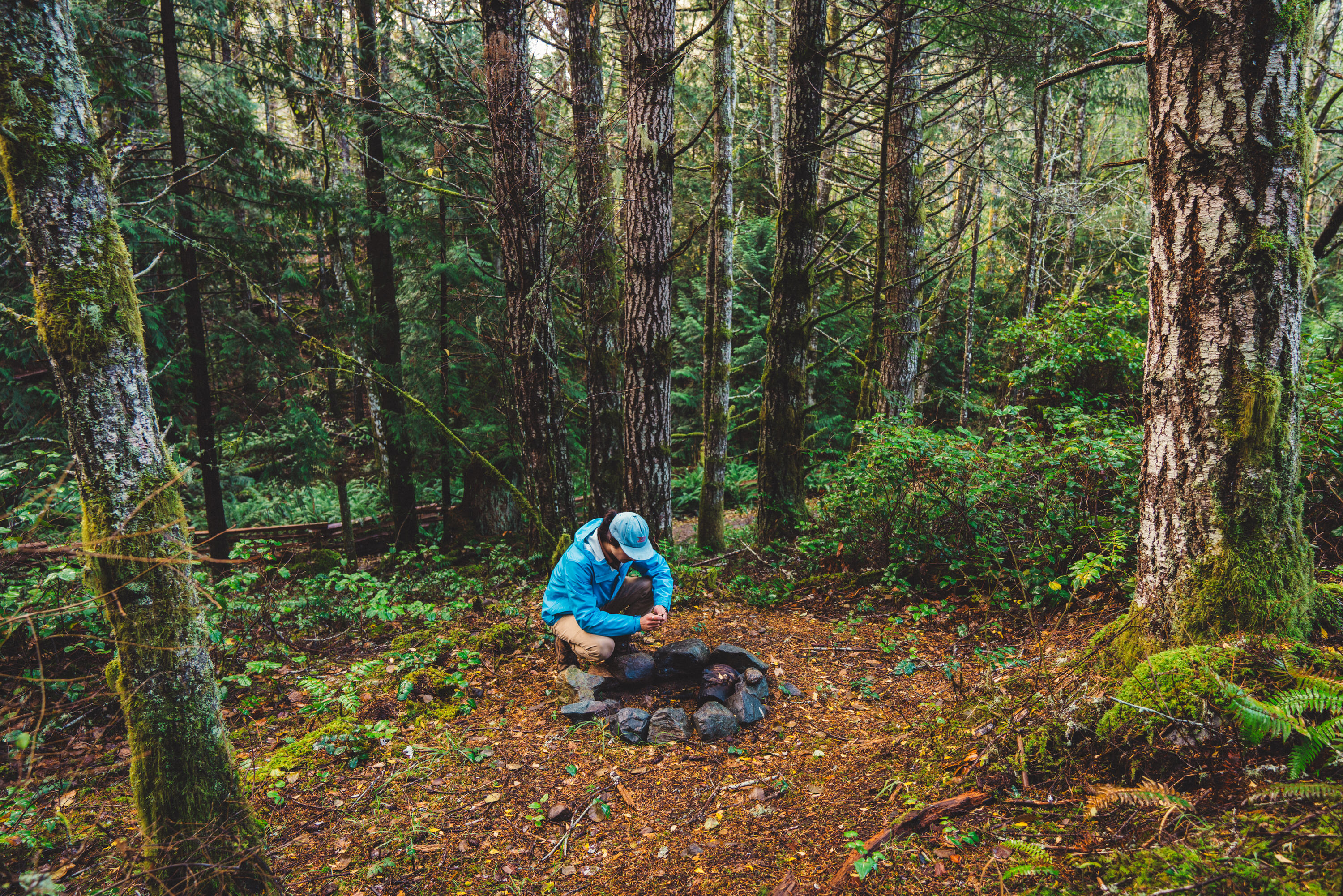 The middle site's firepit, tucked under the trees.