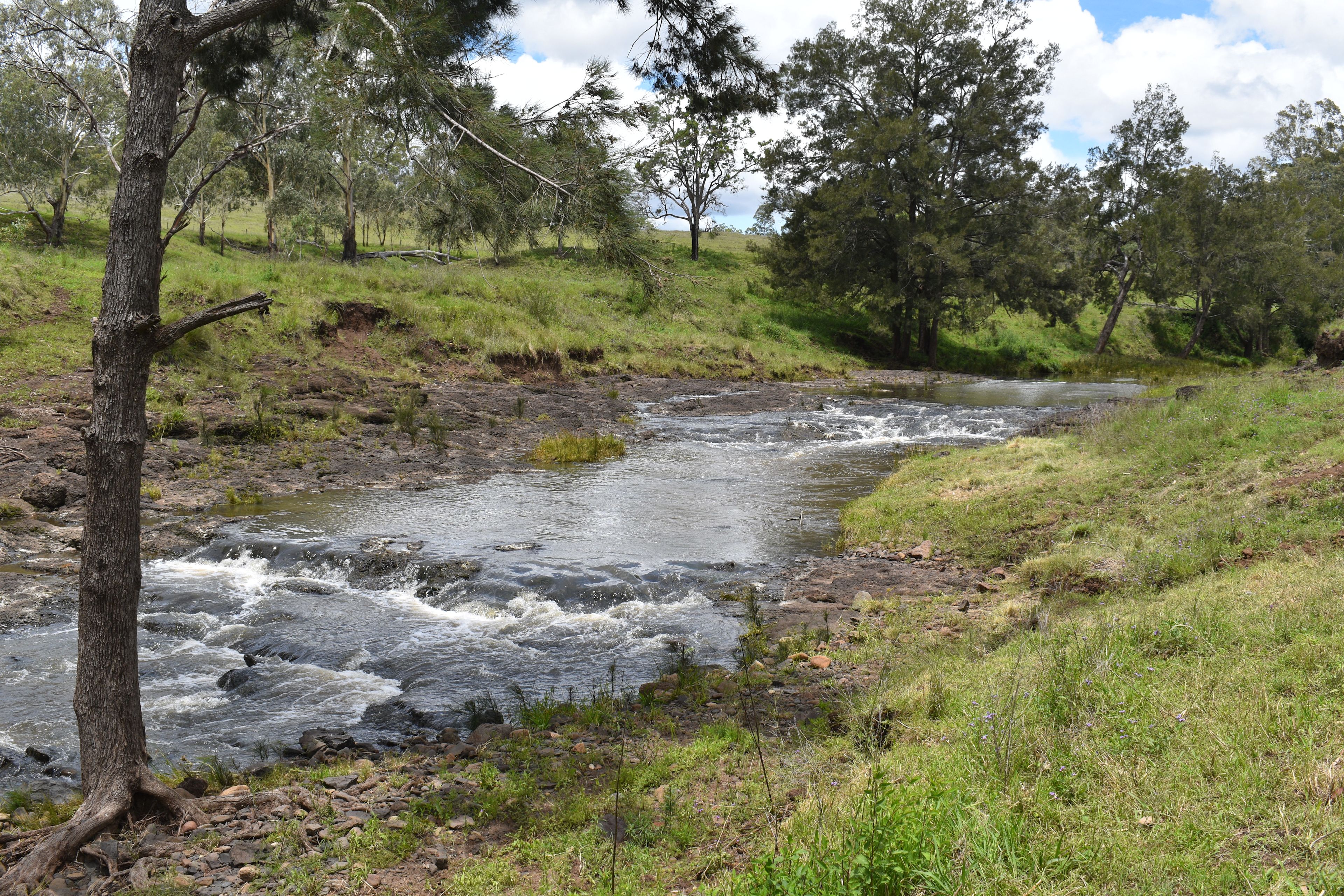 Creek flowing over rocks after storm