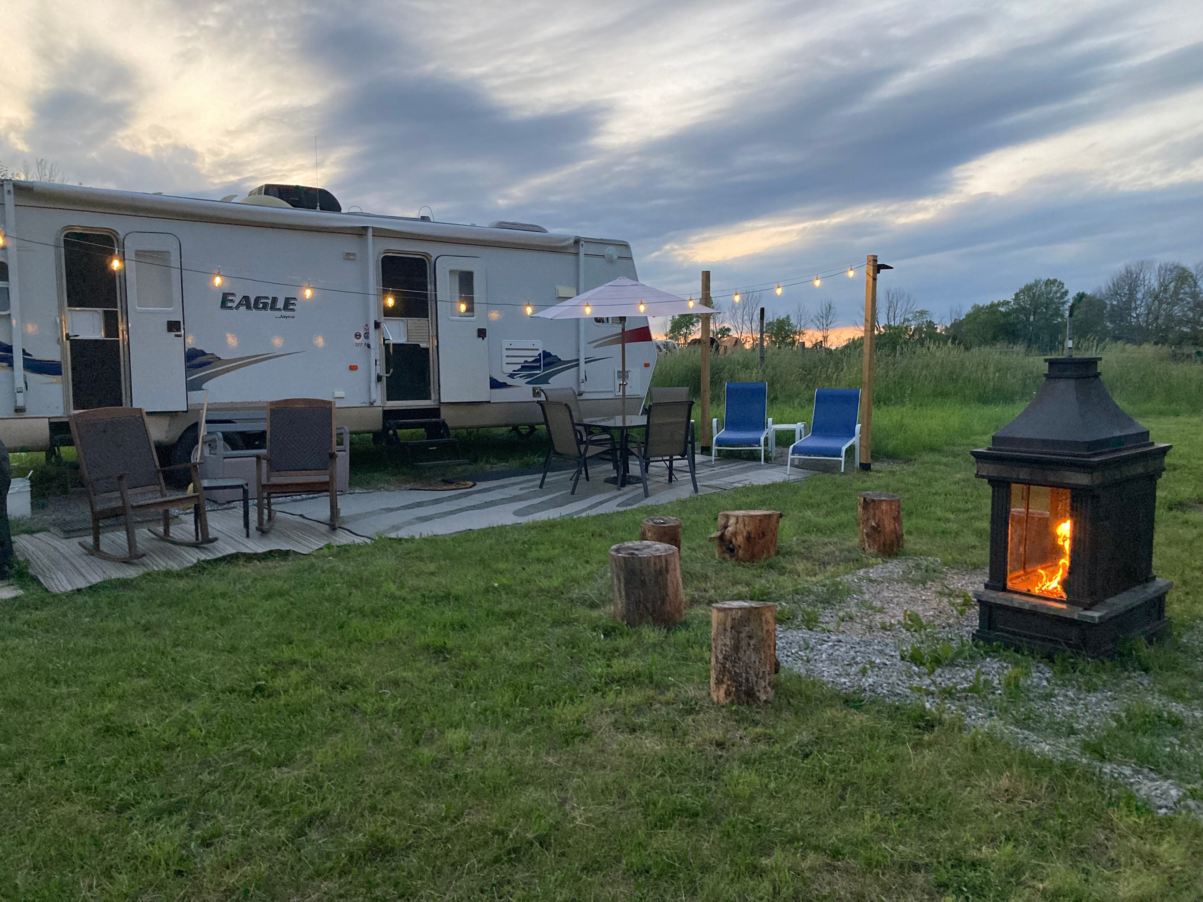 Rocking chairs, firepit, dining area