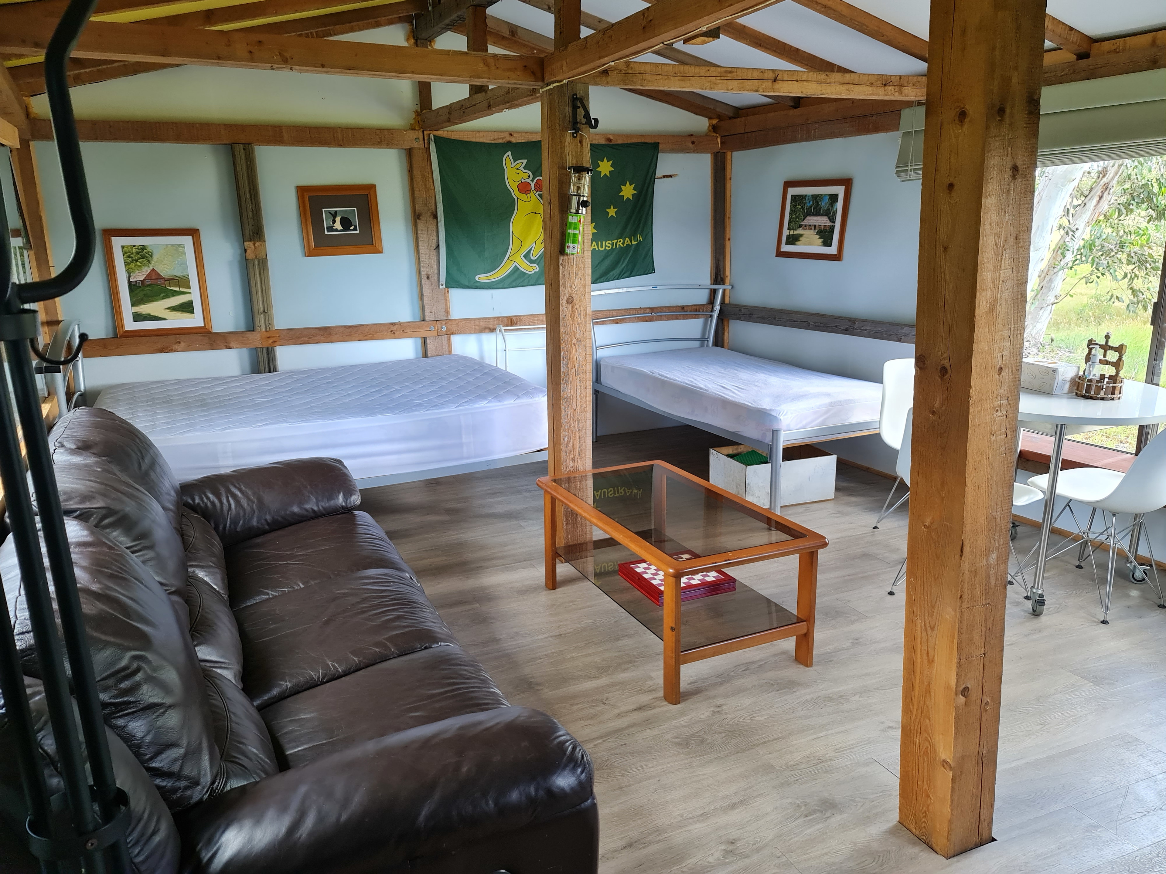 Queen and single beds, lounge suite.