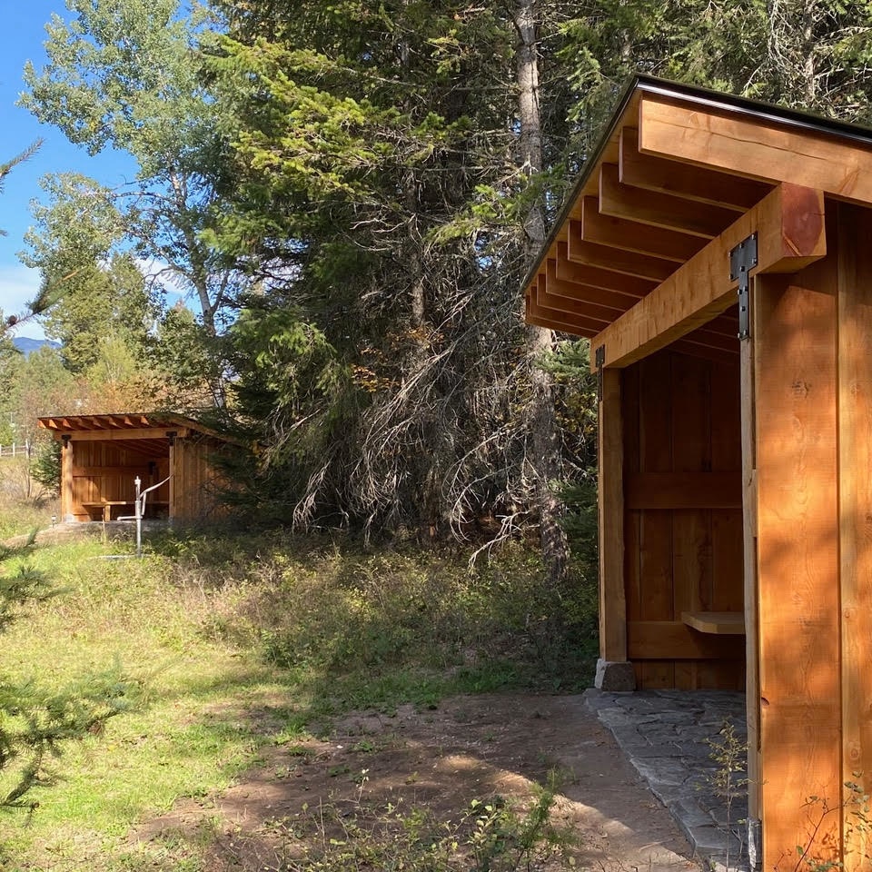 Structures tucked into the woods 