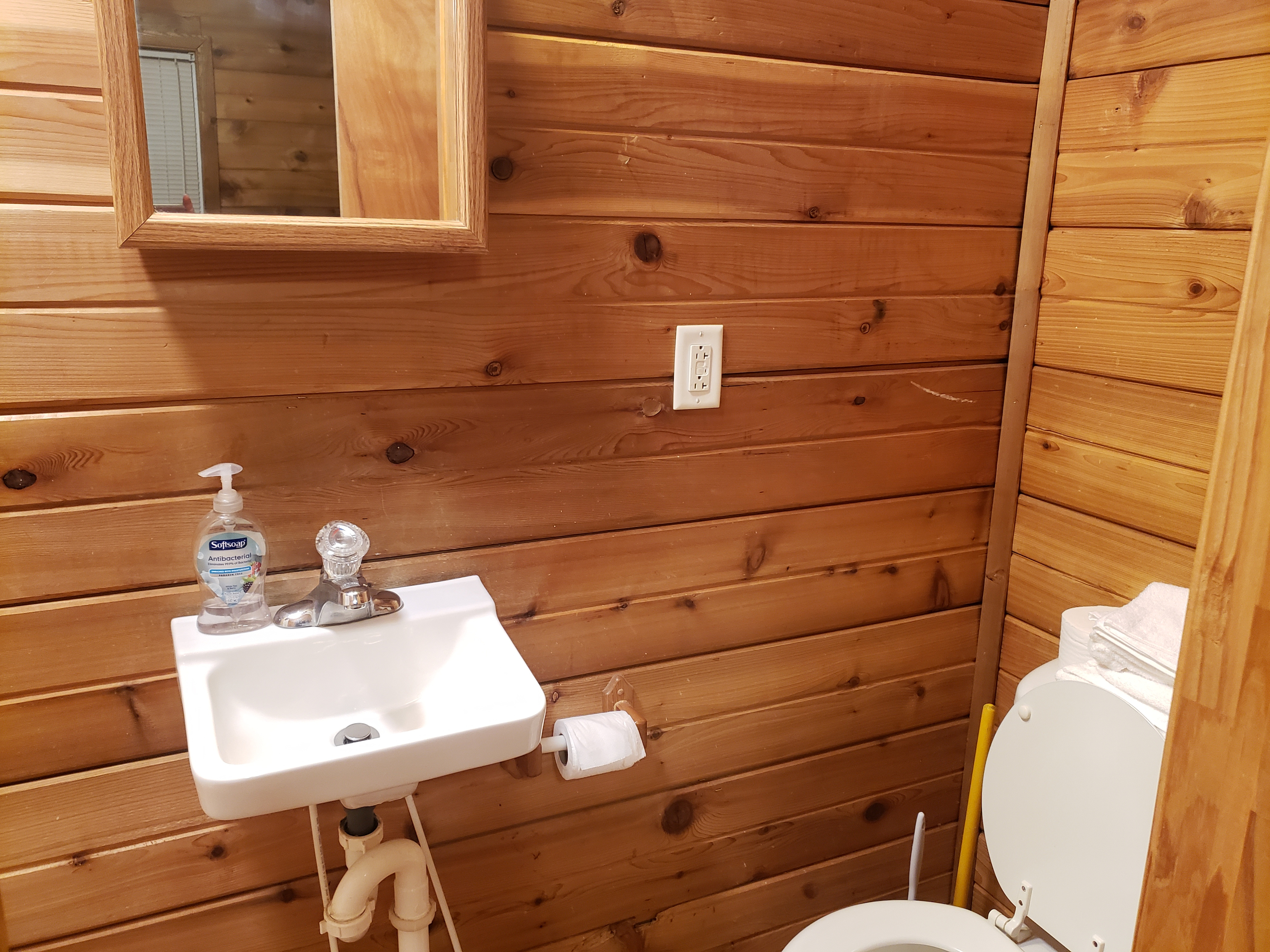 Toilet, sink, and small shower, water ran hot for about 10 minutes so keep it short. 