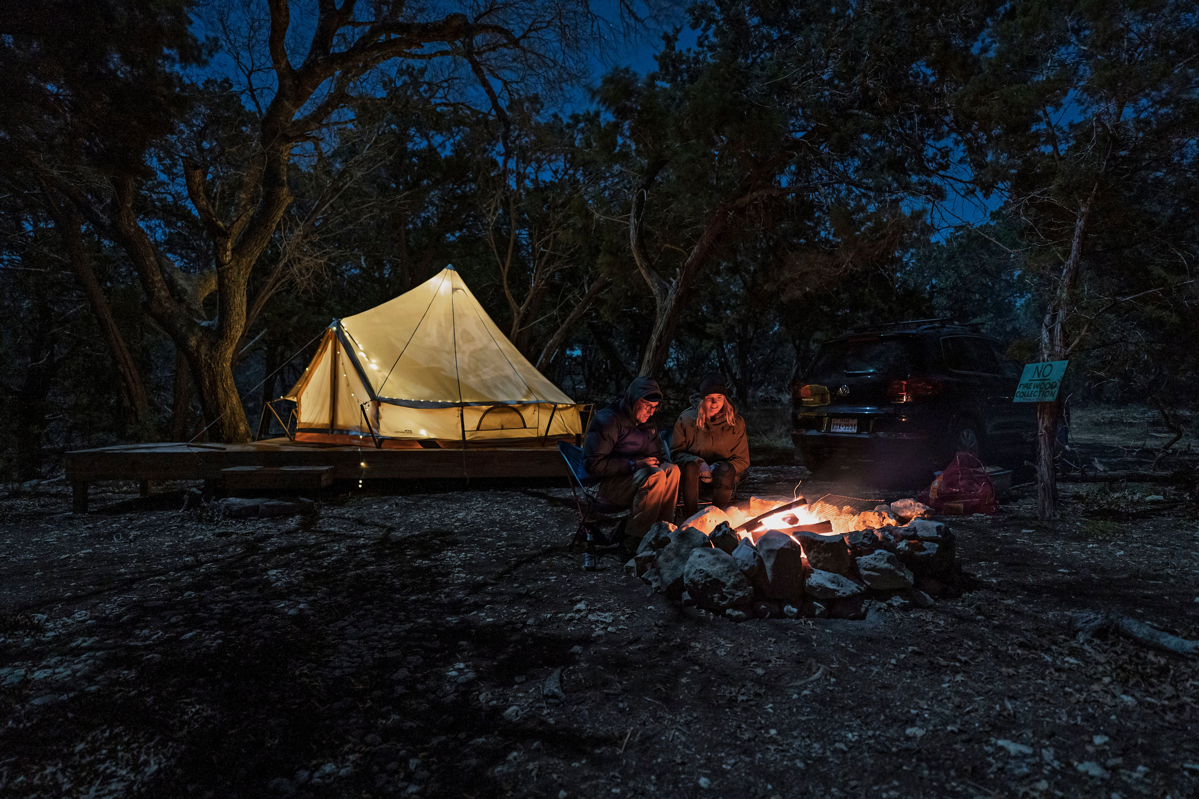 Campfire conversations under a clear night sky.