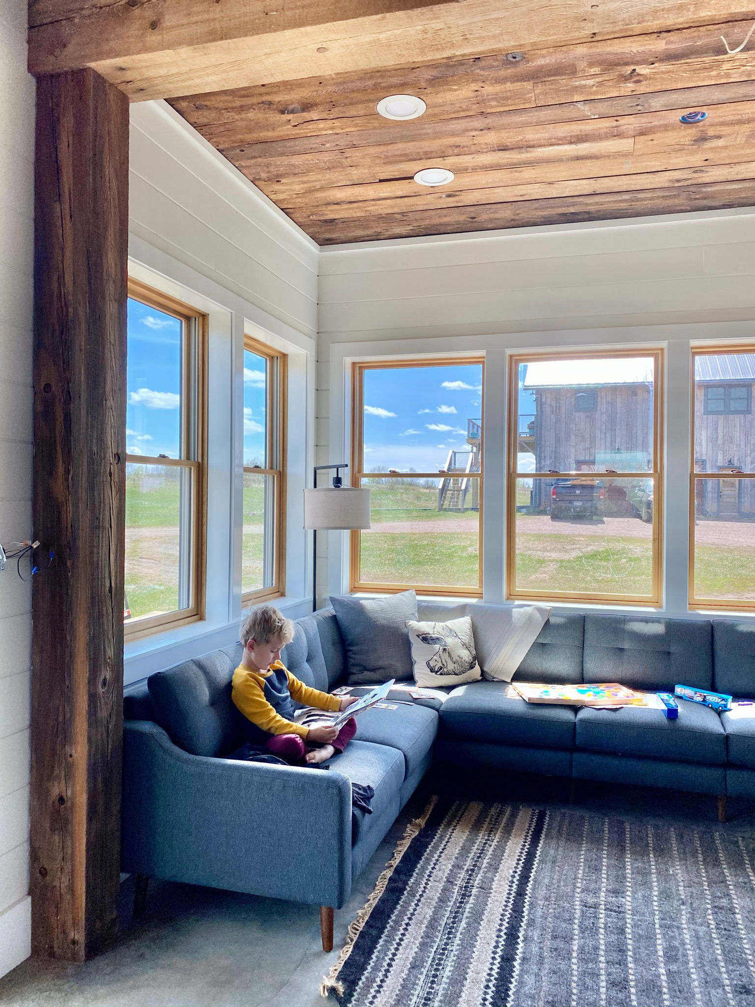 The living room gets full sun and exits to the patio.