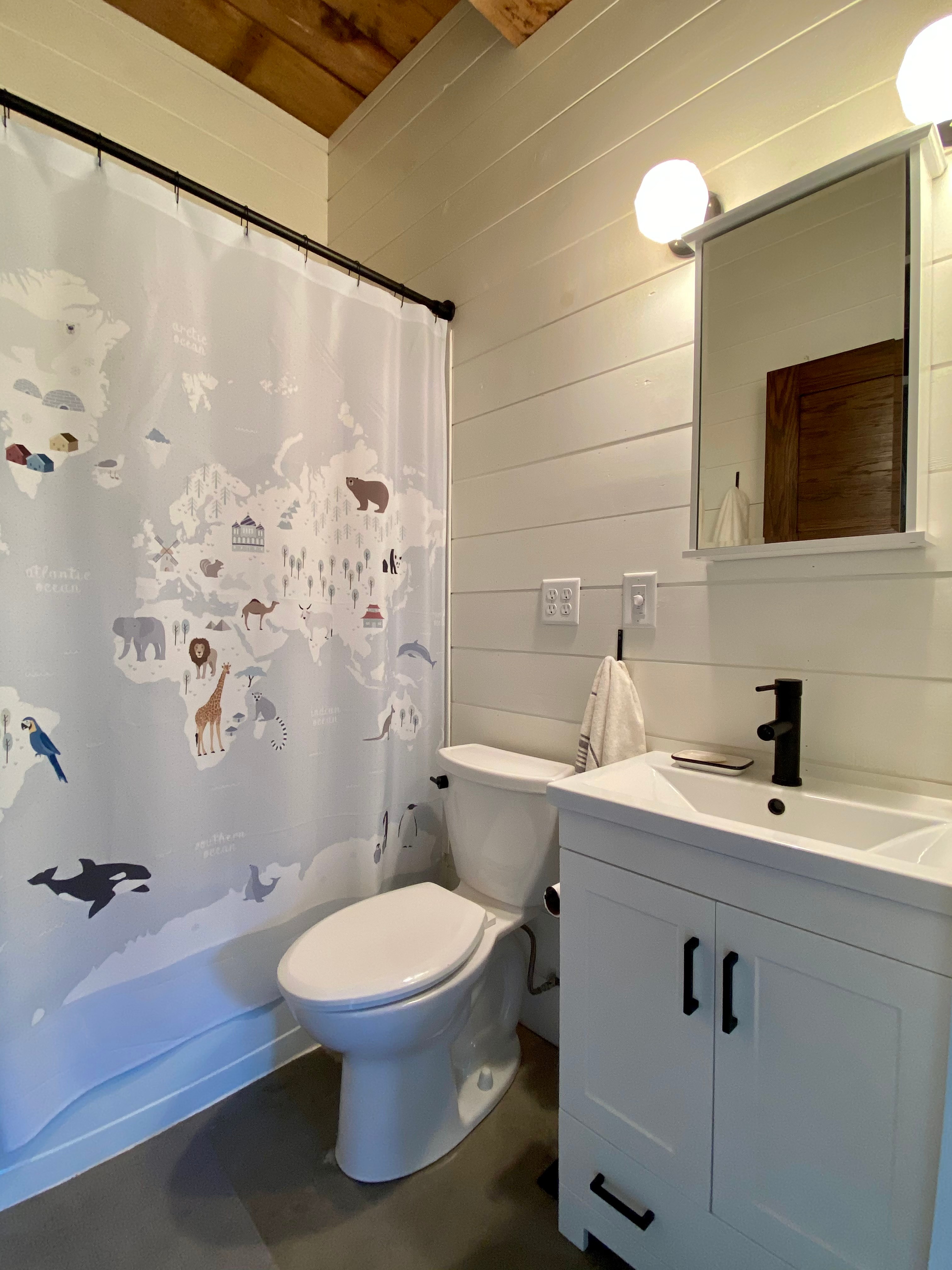 The bathroom includes a shower and full tub.