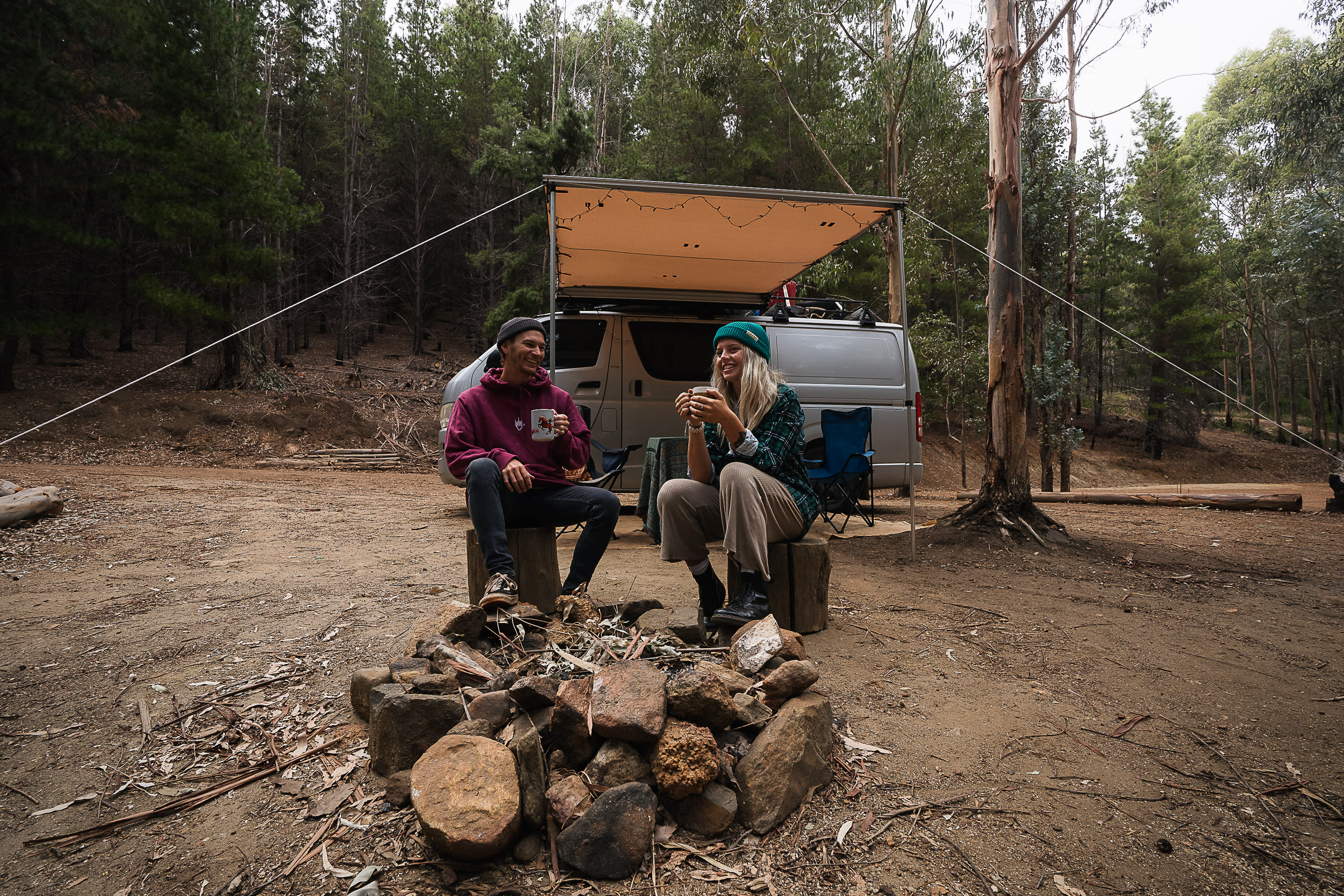 Two campers enjoying morning coffee at the Running Brook campsite.