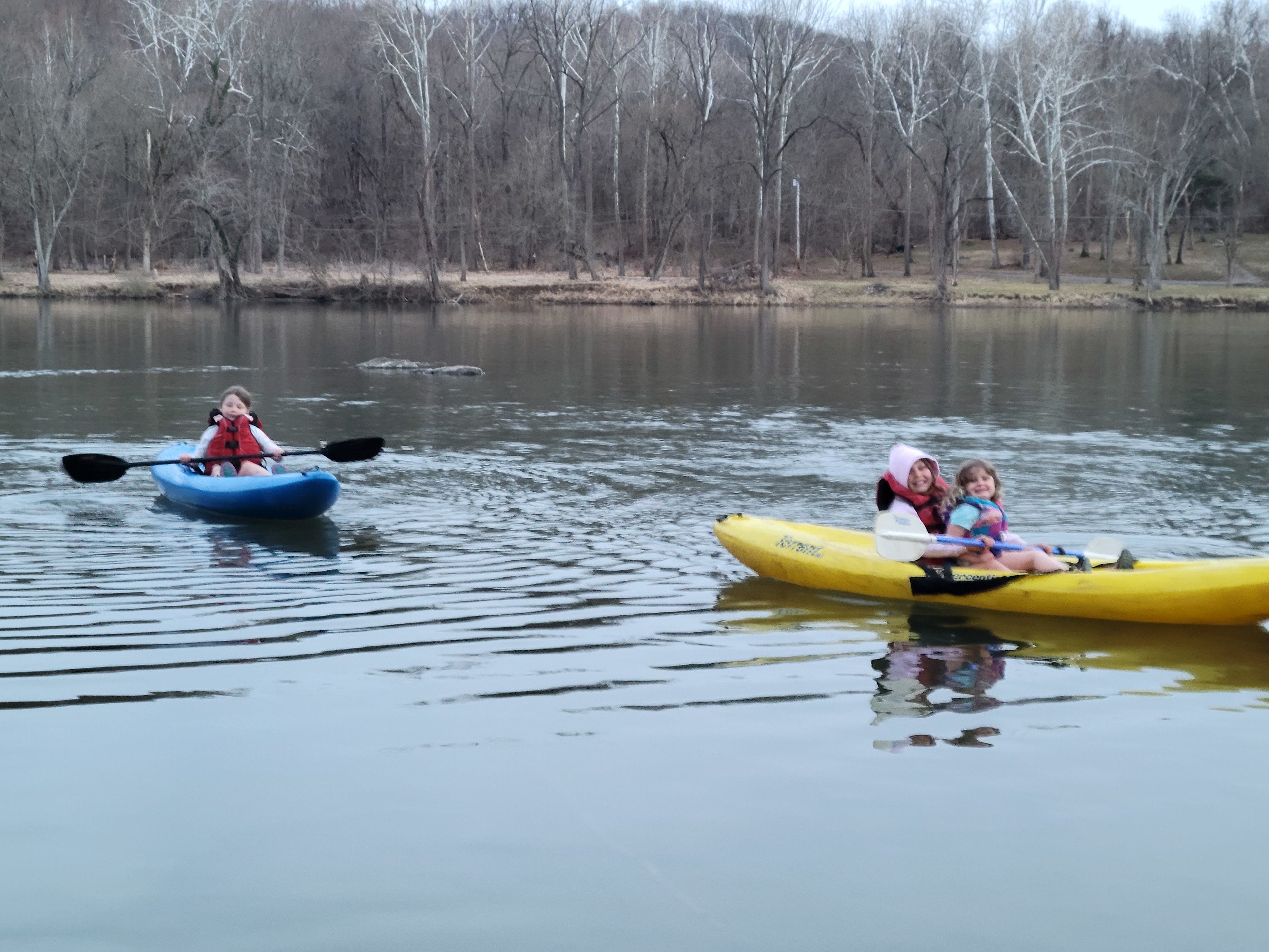 Our daughters enjoying an evening paddle in the kayaks provided for your enjoyment.