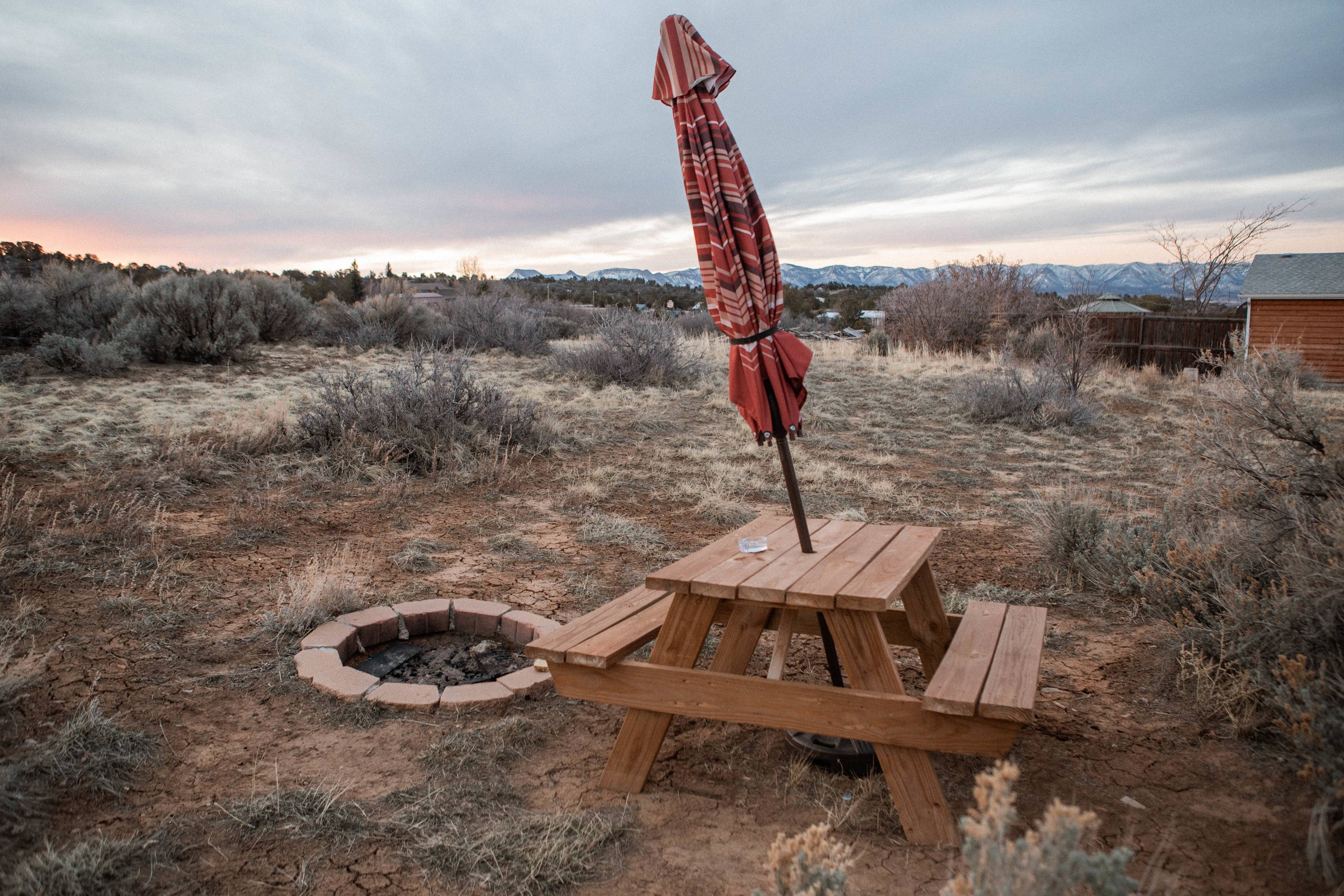 The cabin also has a picnic area and firepit just outside of it as well. 