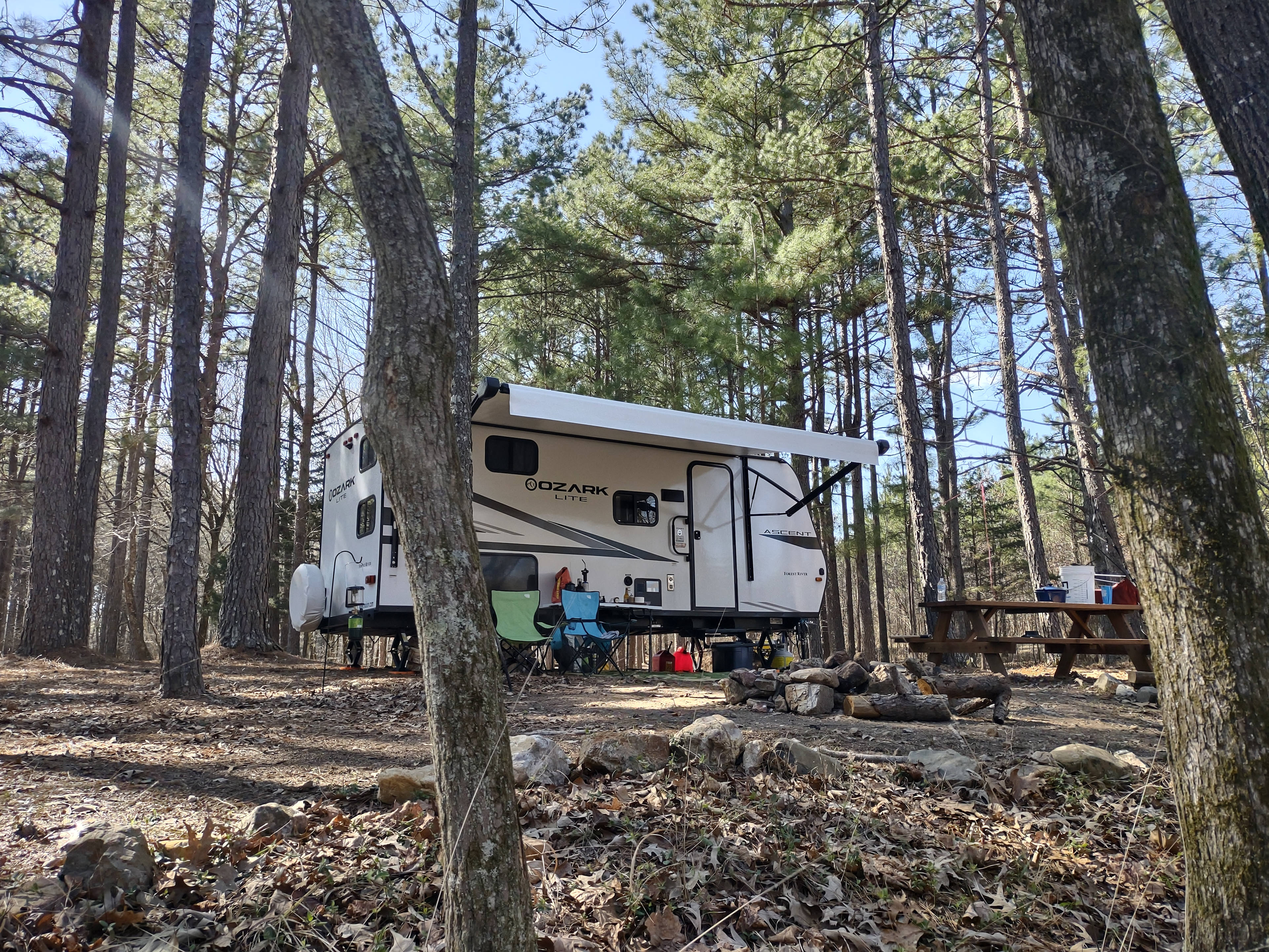 Site 10, hold up to a 25 ft camper. Creekside views.
