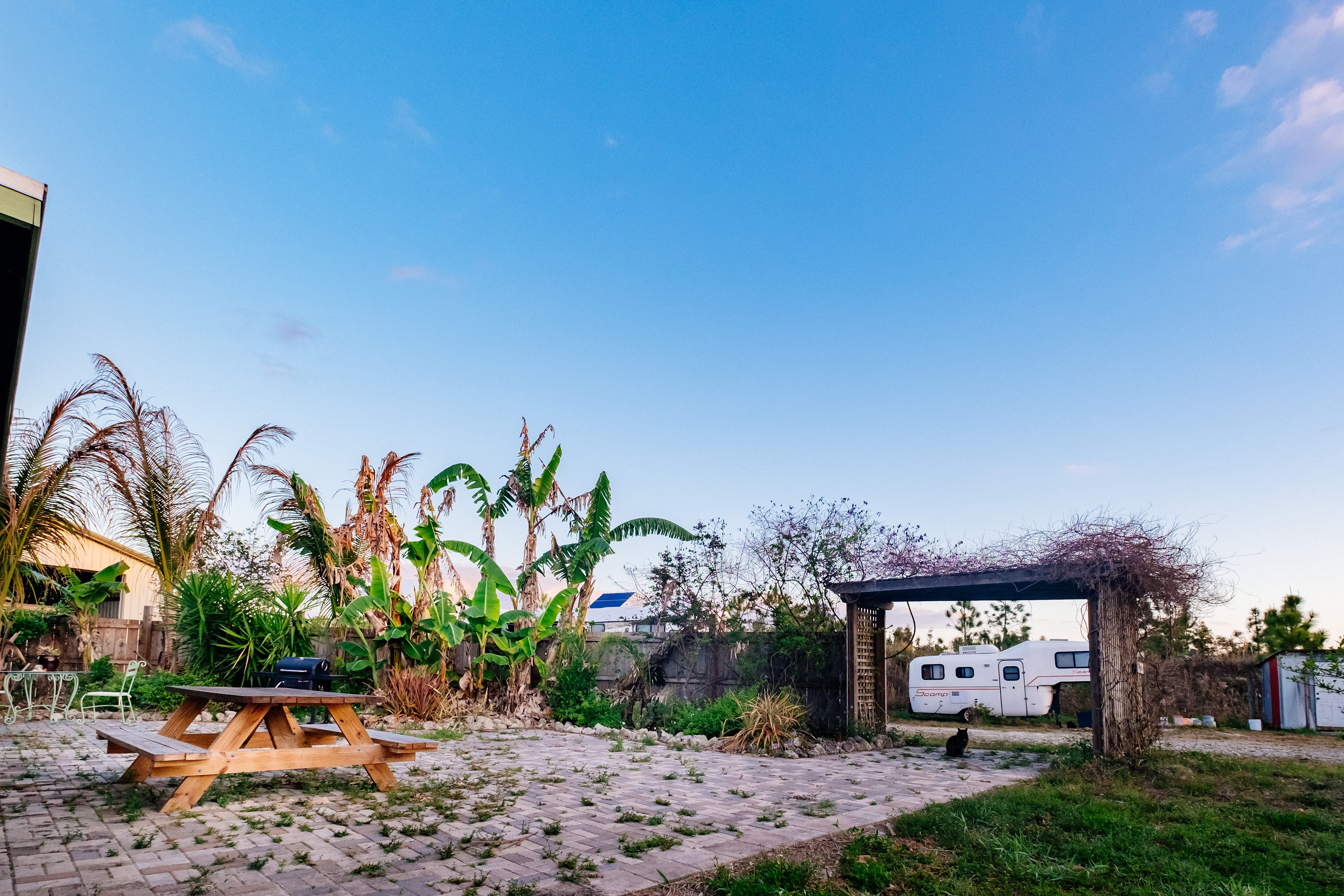Community area picnic table, grill and 2 top tables
