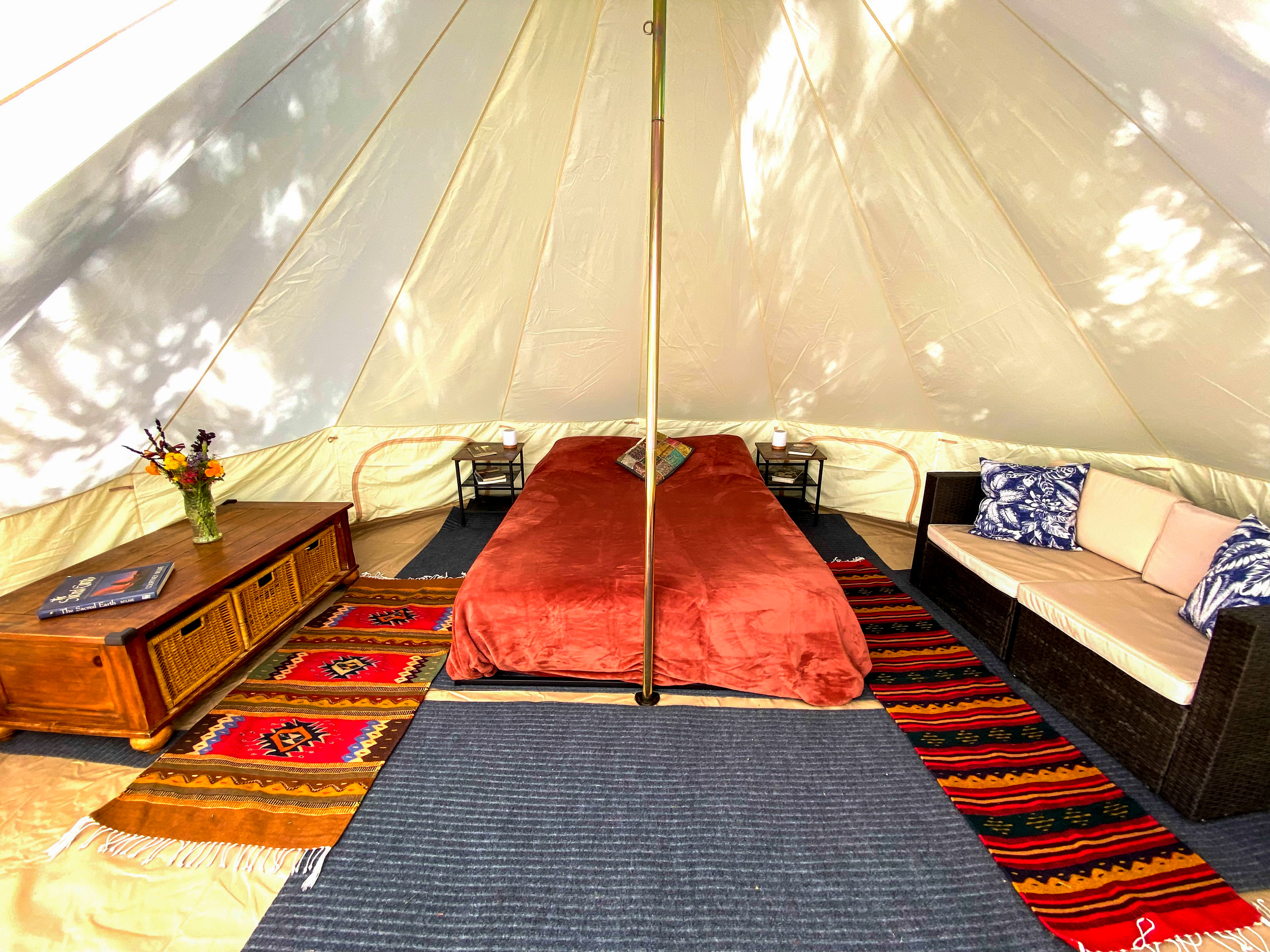 Inside is a queen size latex memory foam mattress, couch, and coffee table with storage drawers. 