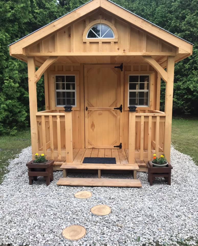 The Meadow River Cabin with a cute front porch.