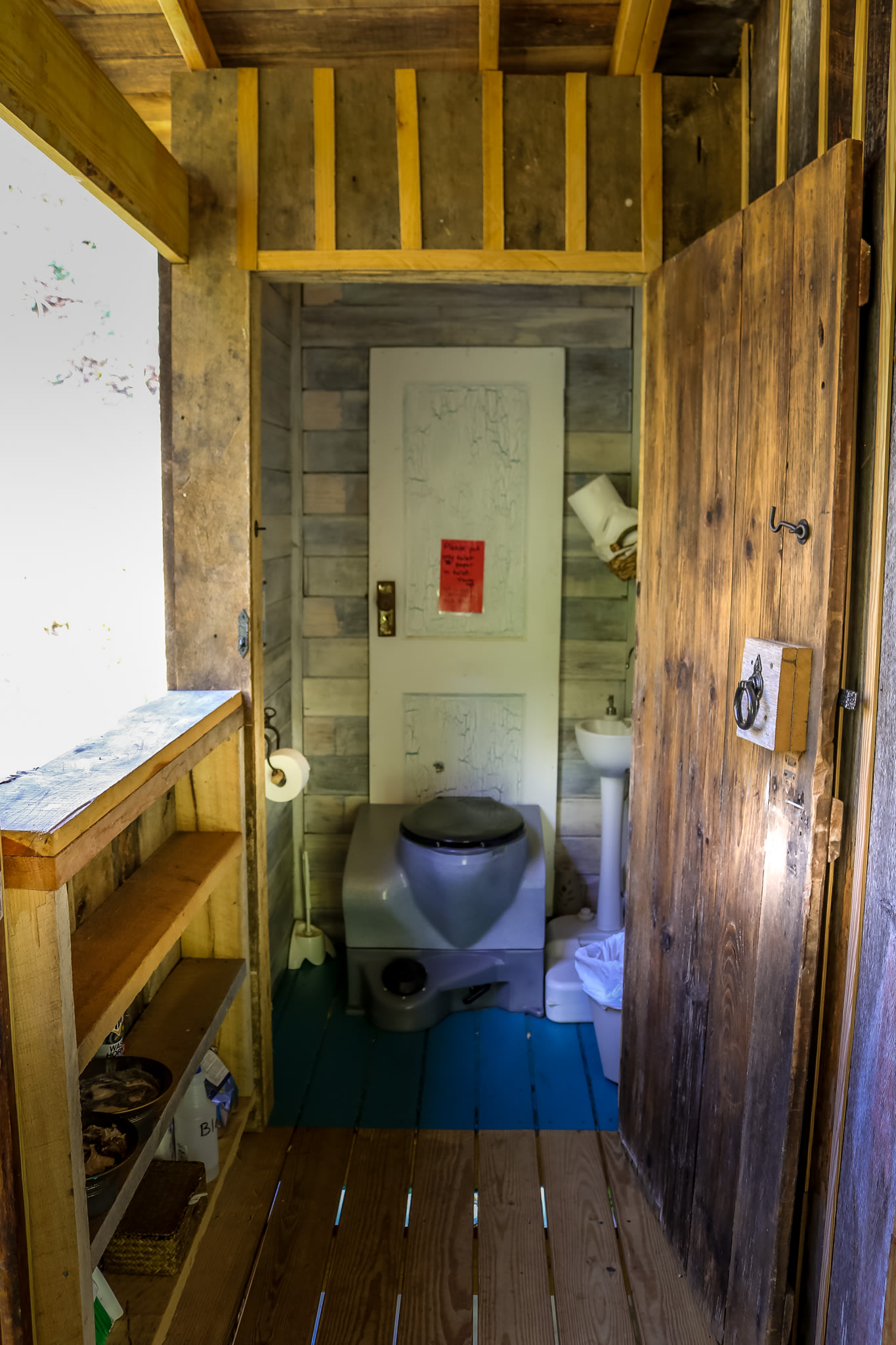 The outhouse, but structurally connected to the tiny house!