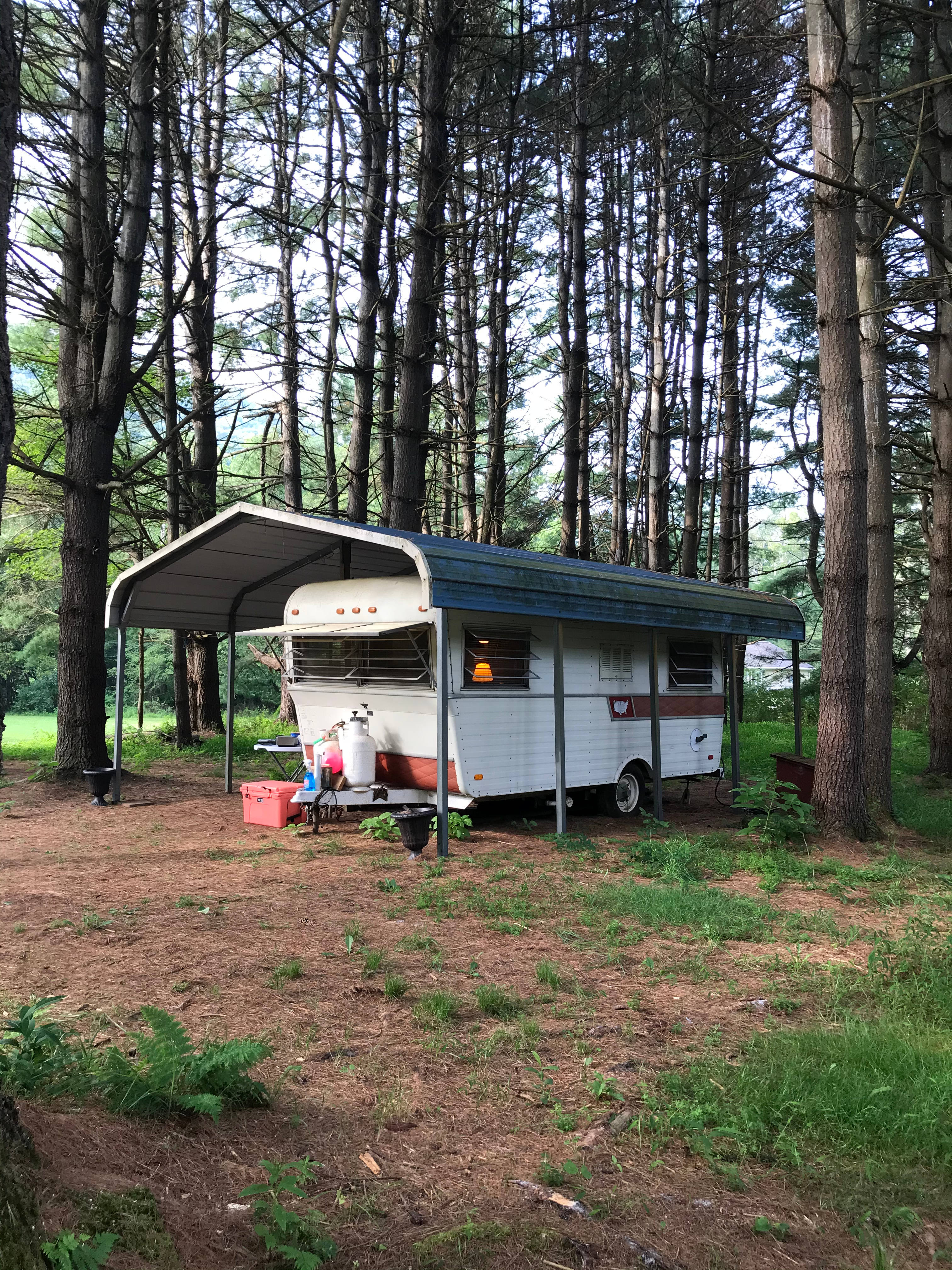 1972 Canned Ham 15’ camper for a vintage stay.