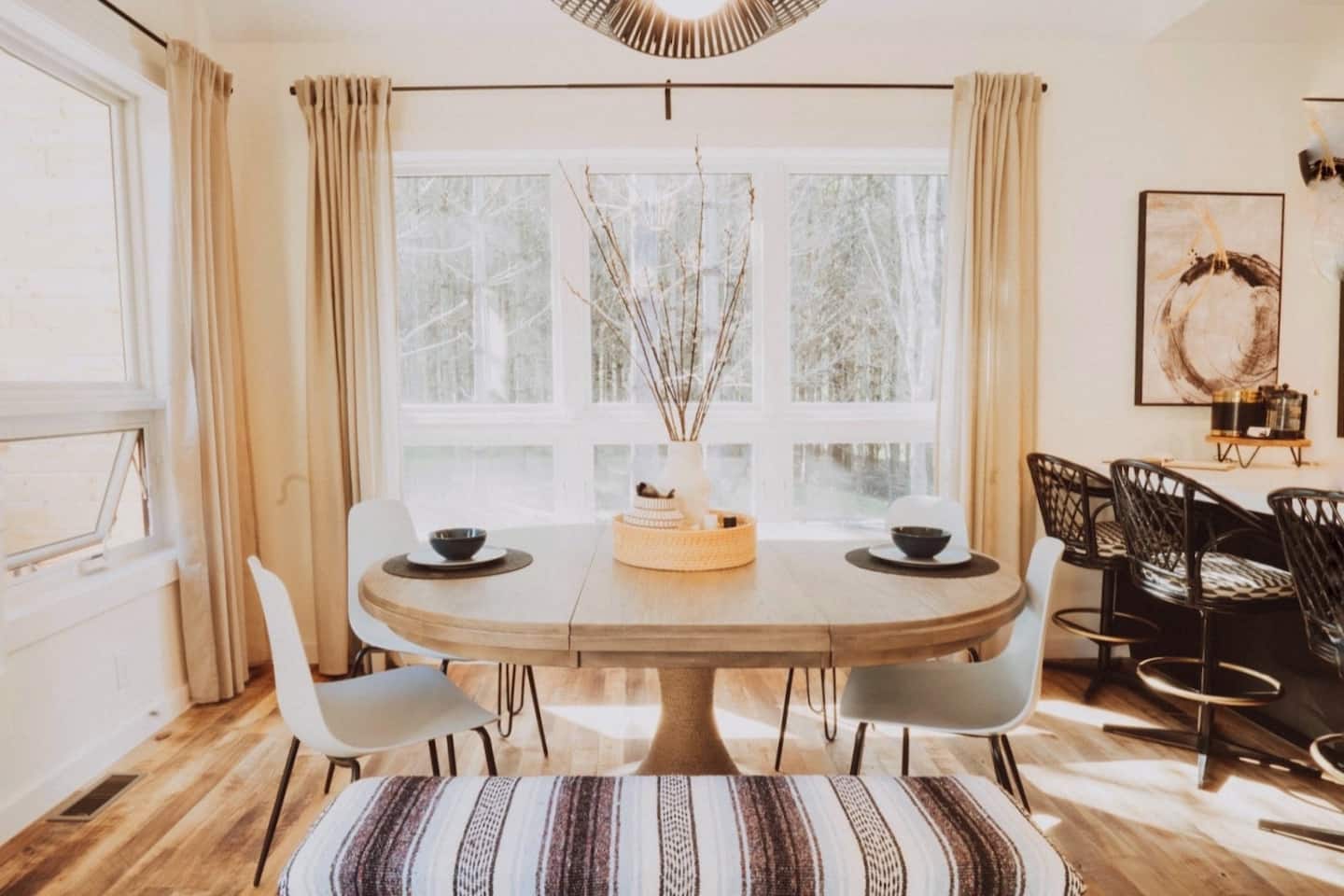 The dining room has forest views and seats up to 10 at the table, with 4 more seats at the bar
