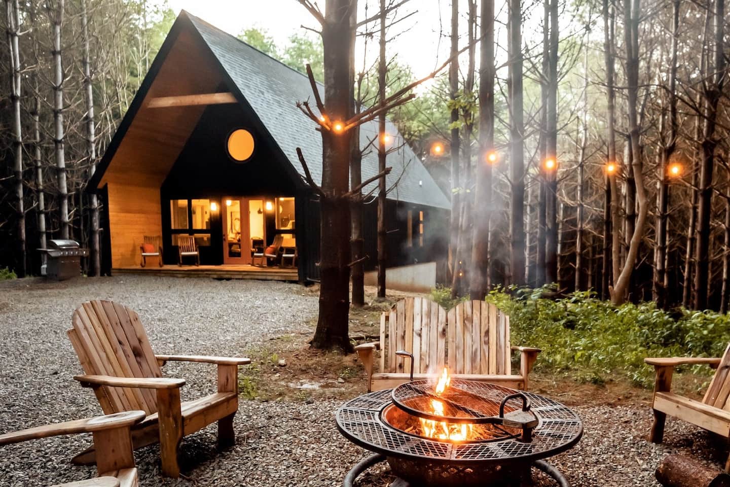 The fire pit is a popular spot year round and included a grilling rack for cooking over charcoal or wood
