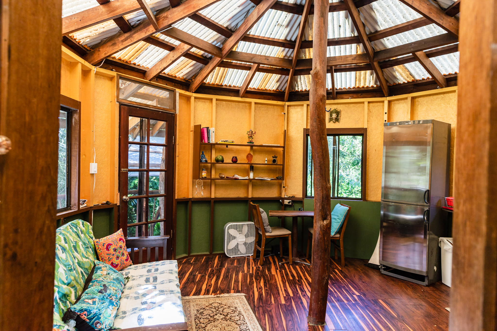 Inside with couch, tables and chair.