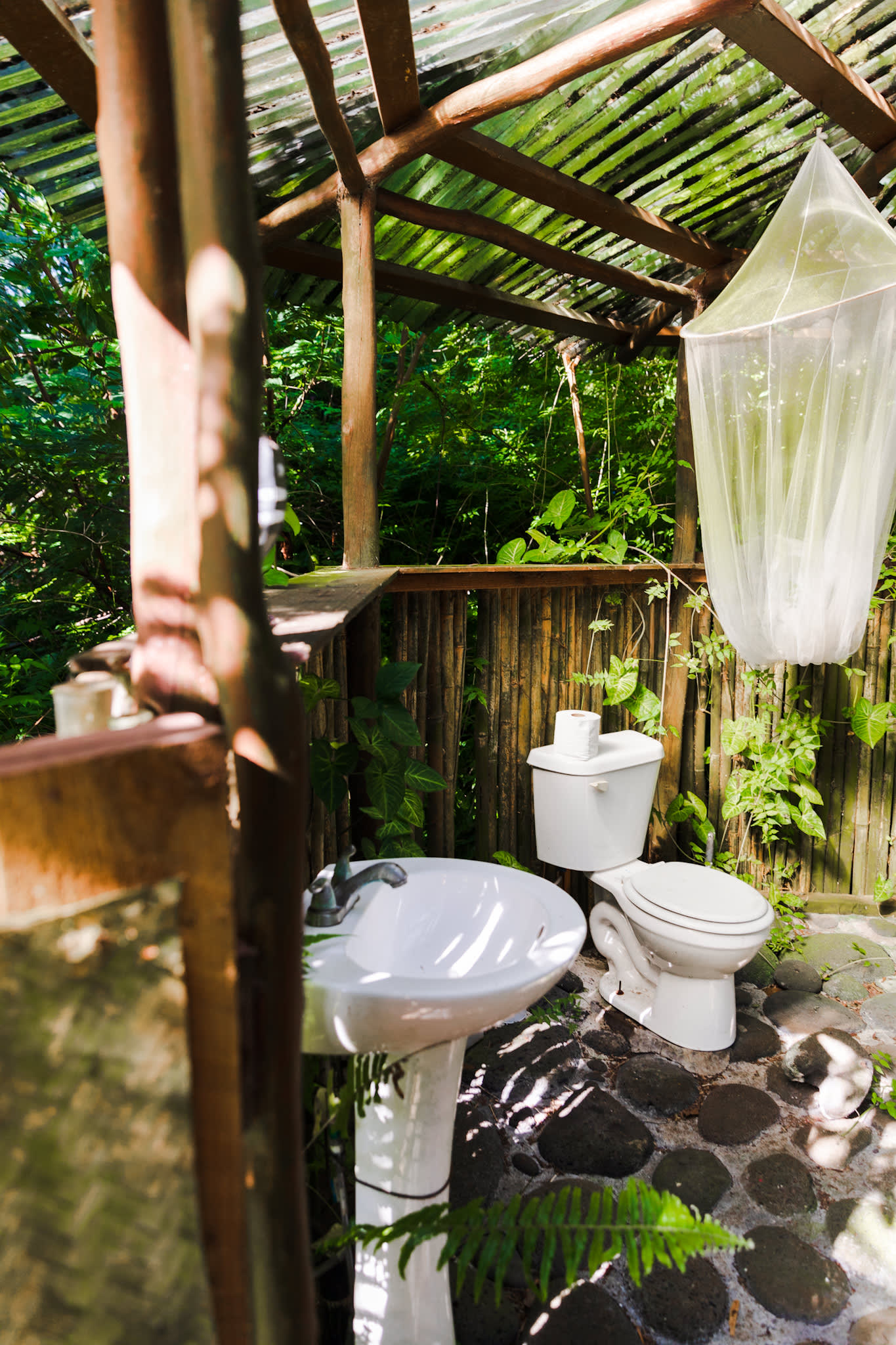 Outdoor toilet and sink.