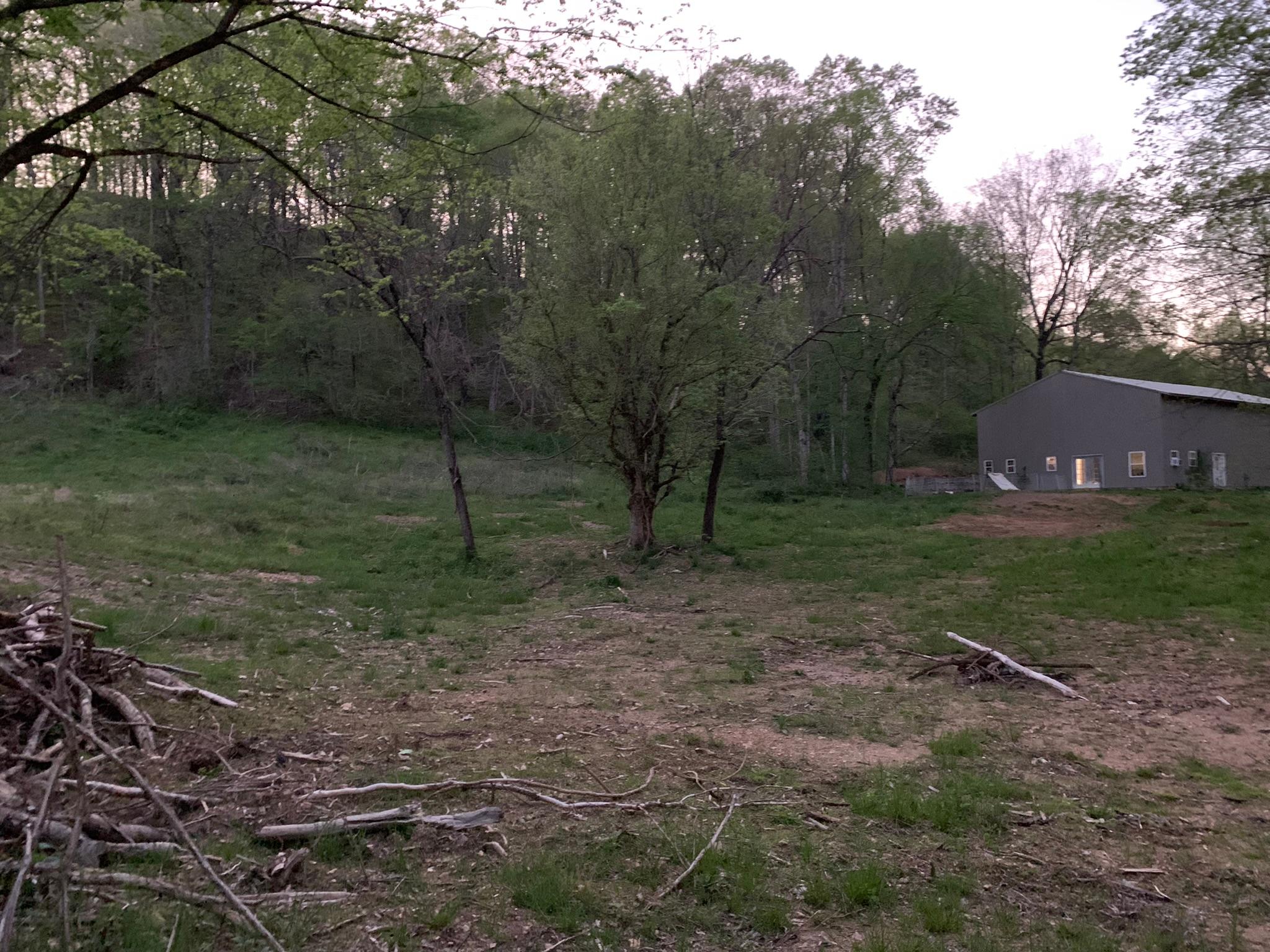 Middle of property, view of main house from camping and platform area.