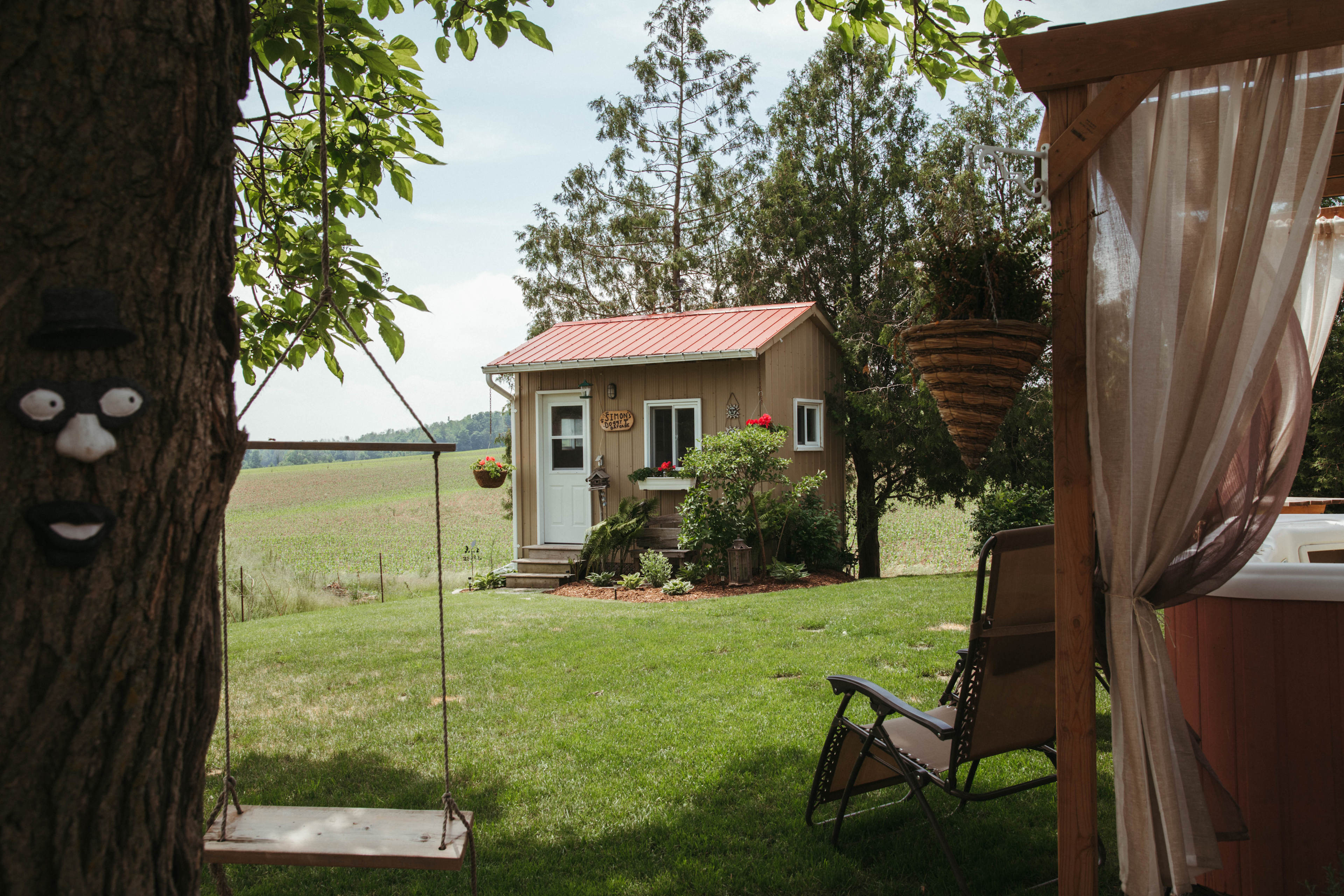 Just behind their home, Pedro shares a large and beautiful yard with visitors. This could be in the bunkie, but also in a tent or a trailer in his driveway.