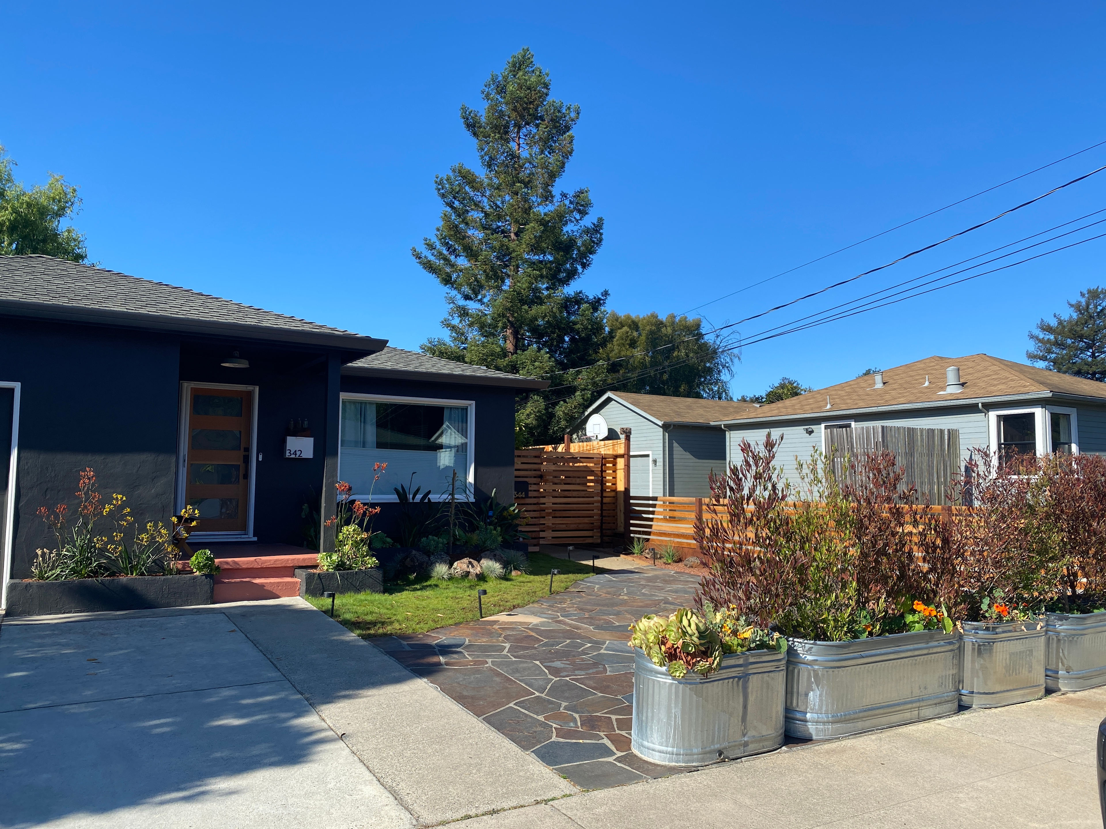 Flagstone area for off-street parking (perfect for a van)!