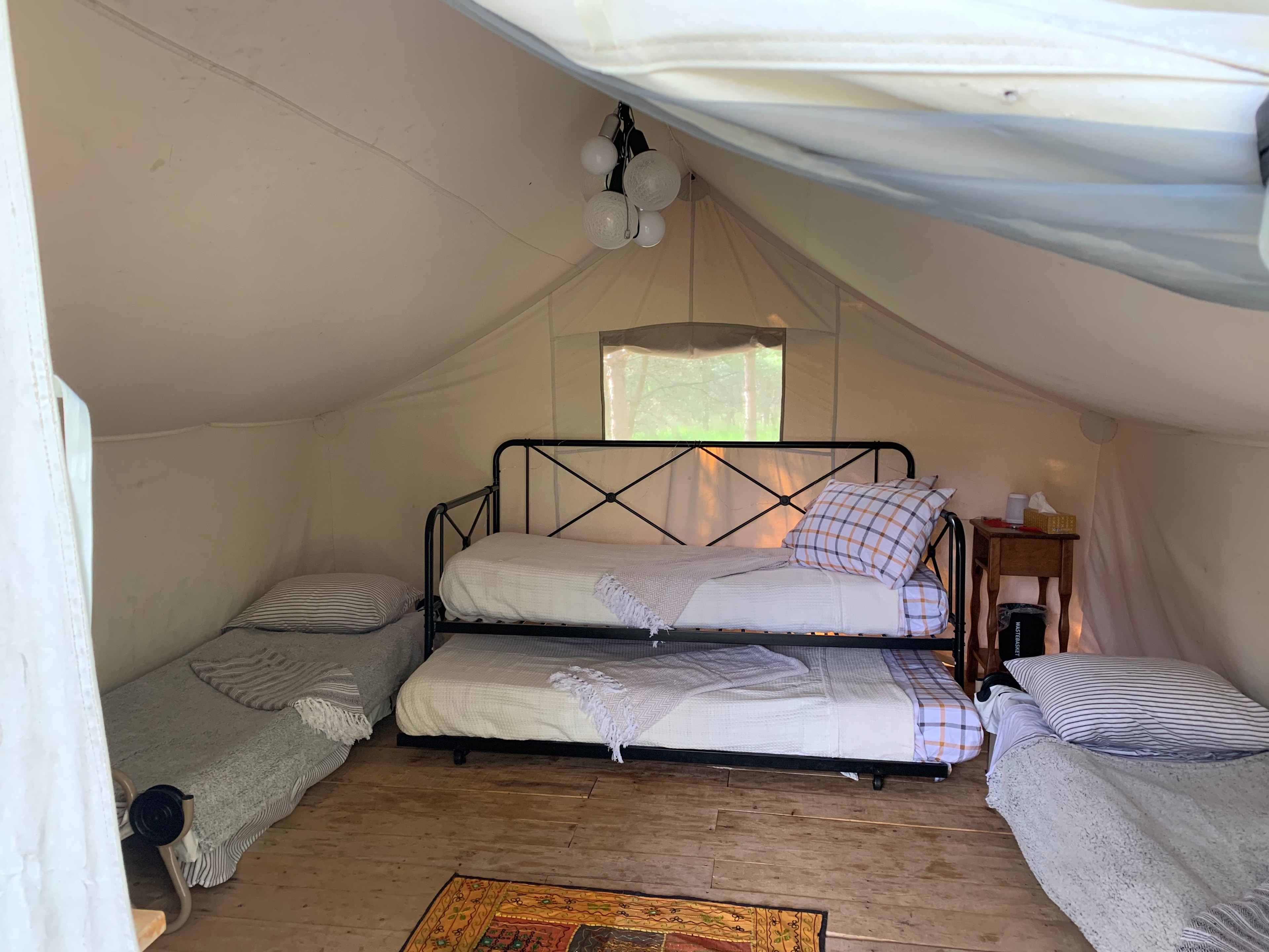 4 person stay. 2 singles can be set up as a double - but it does make daytime space pretty tight - especially if you want to set up card table