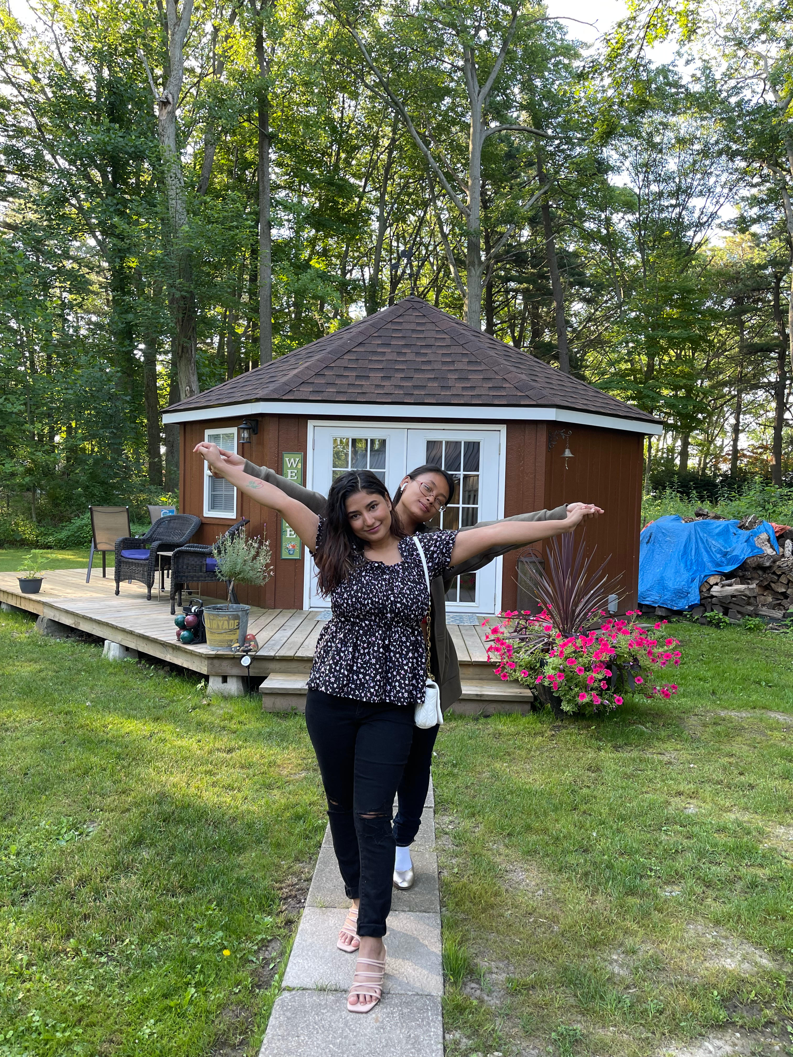 With best friend in front of cabin 