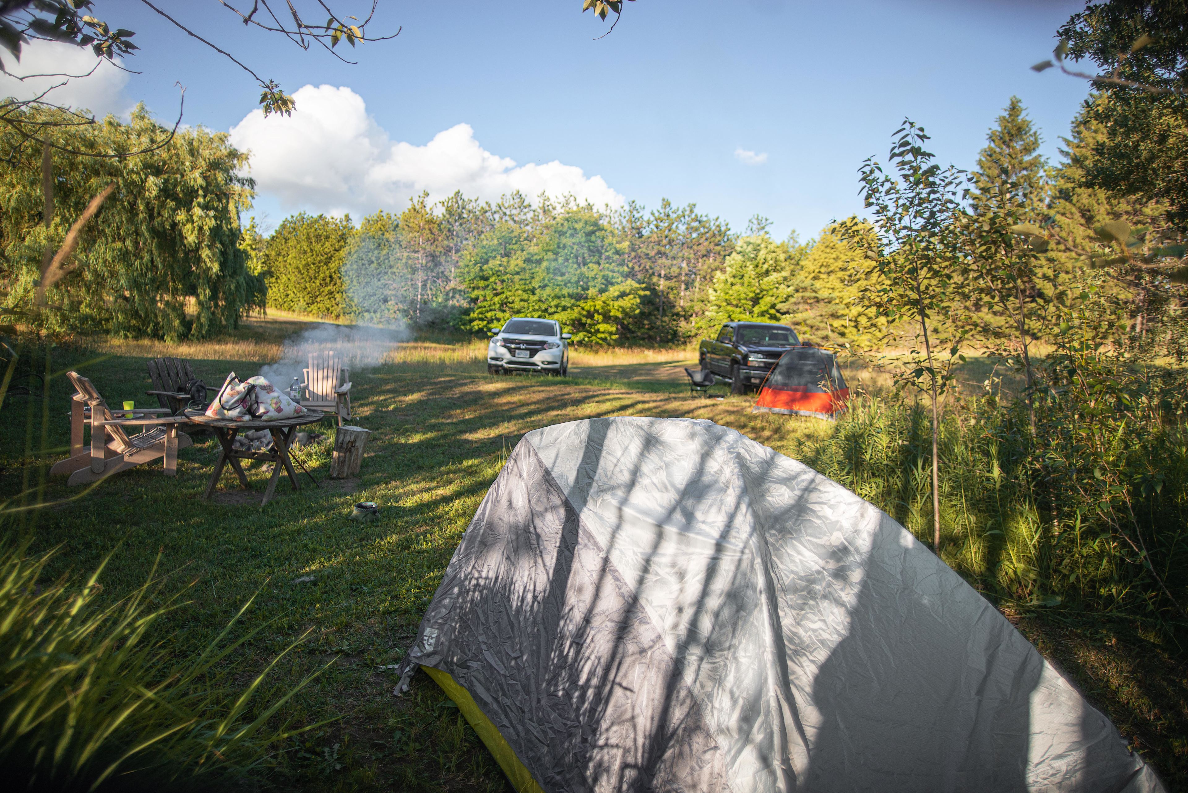 view behind second tent into site.