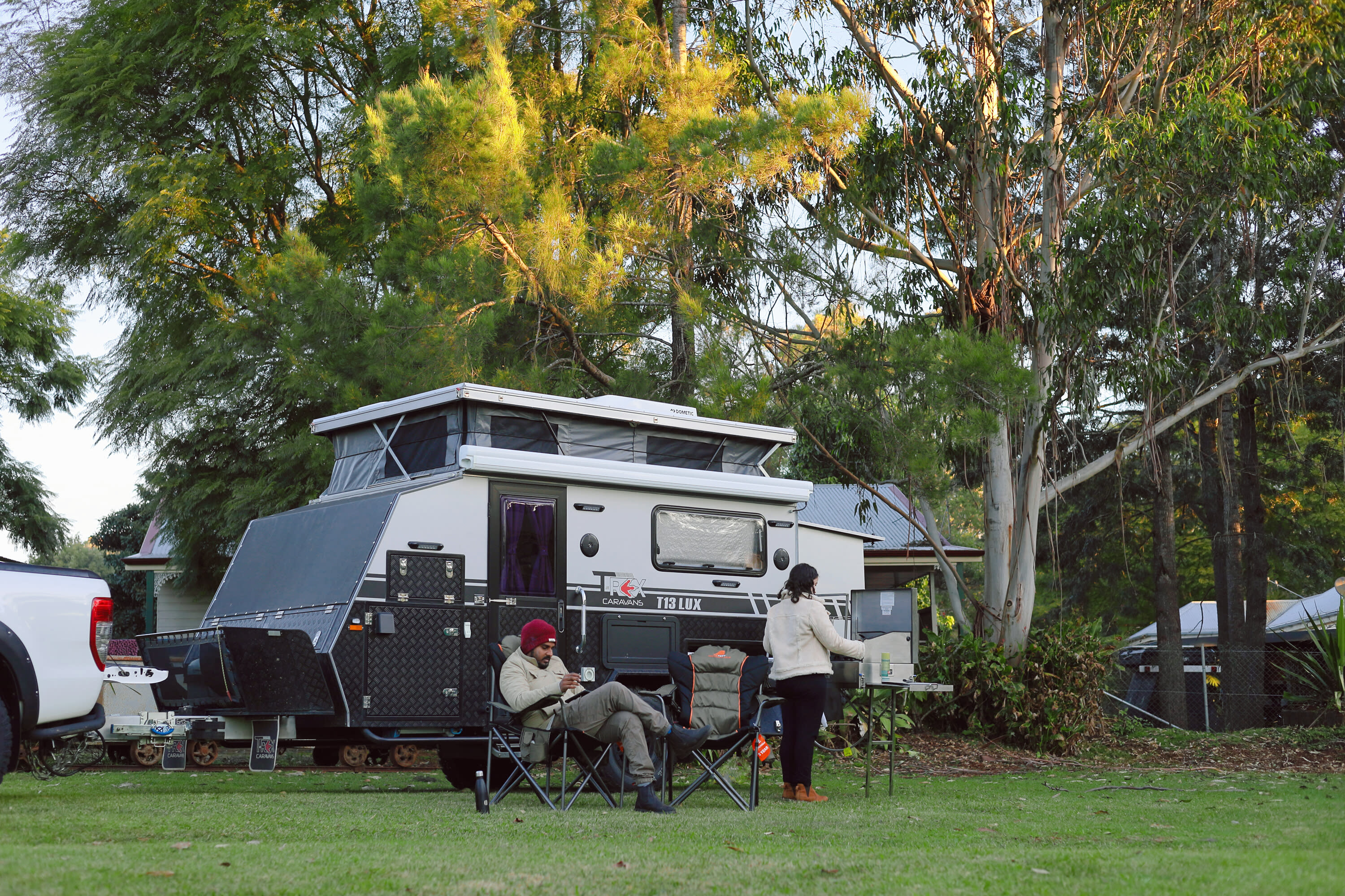 The campsite is leafy with manicured lawns and gardens.