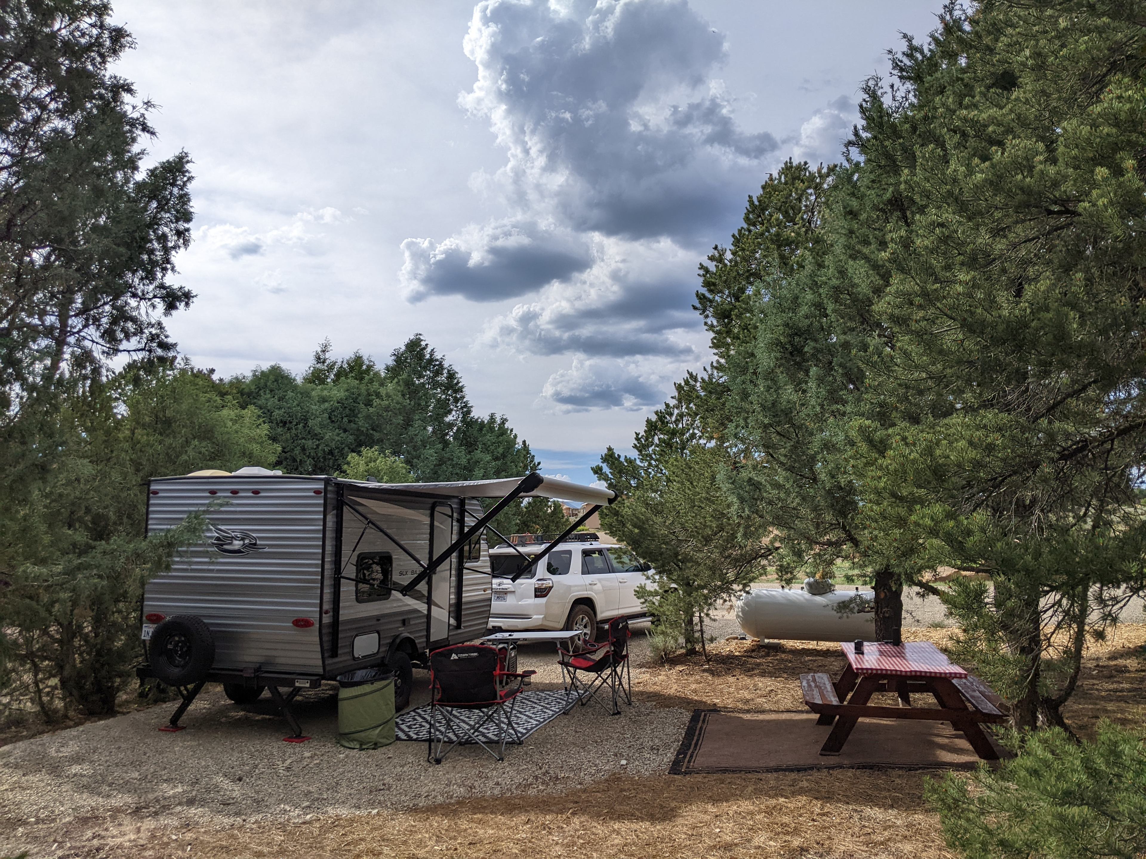 Full hookup spot with table surrounded by short trees. Within partial view of owners front porch. You can see it partially thru the trees from where our trailer was facing. No one was home when we stayed here so it worked out for us. Very clean and well cared for spot. Owner is very friendly and helpful!
