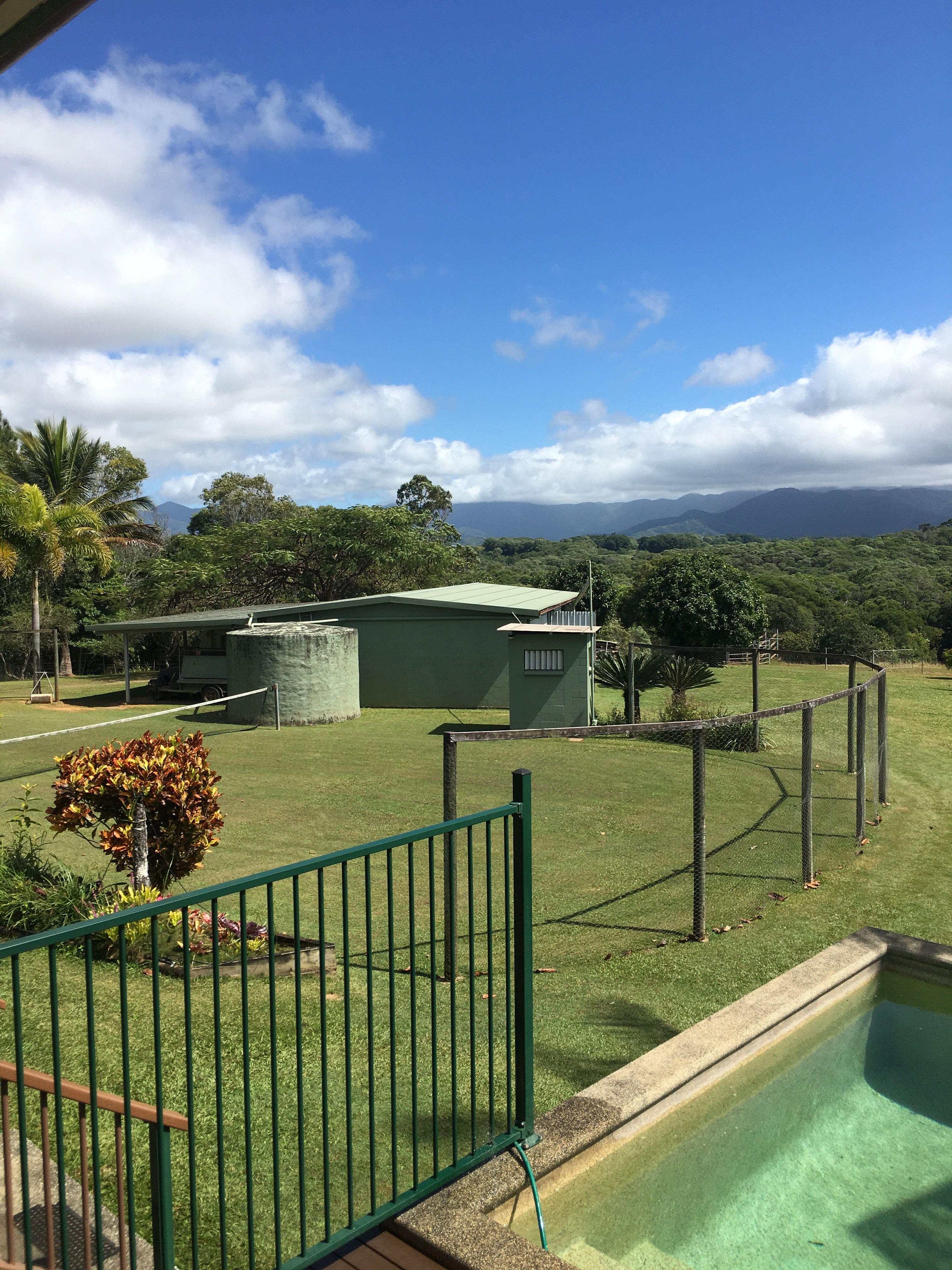 Grass tennis court & outdoor loo.