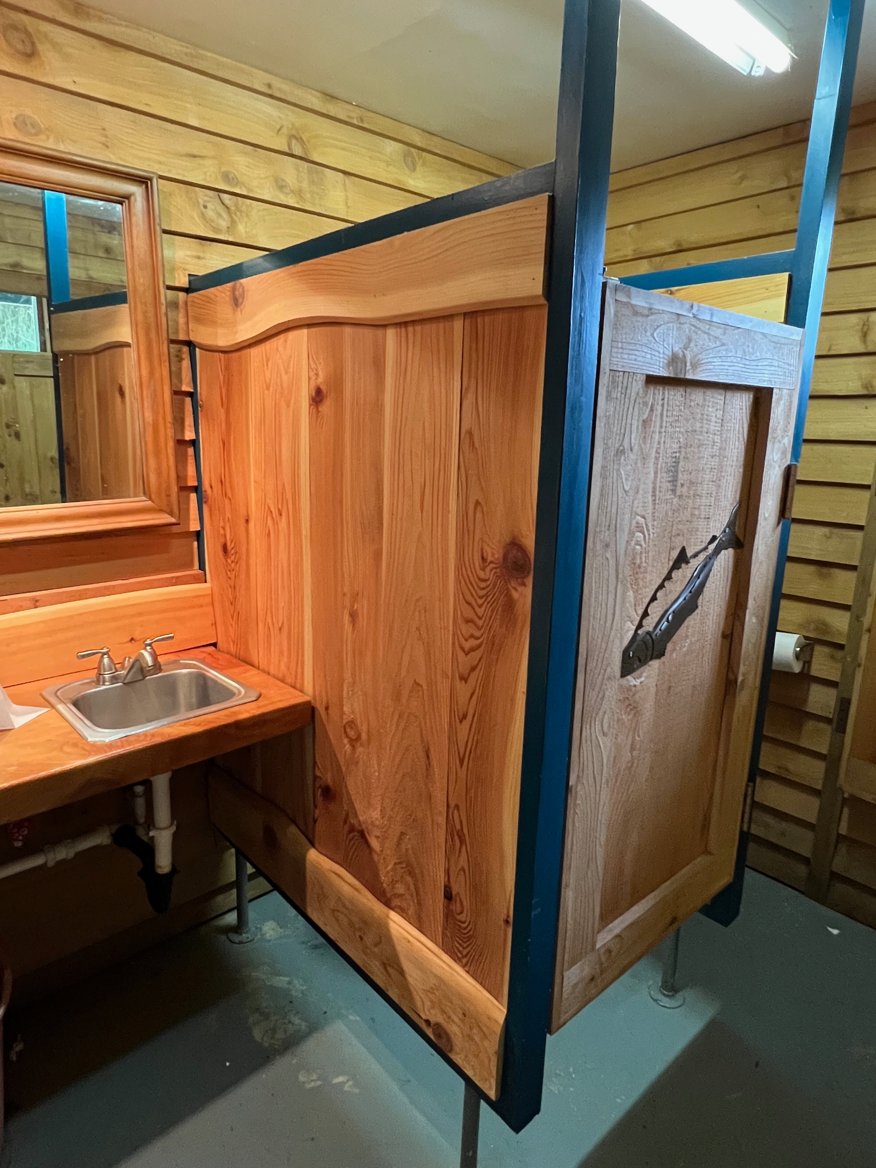 Flushing toilets and a sink.