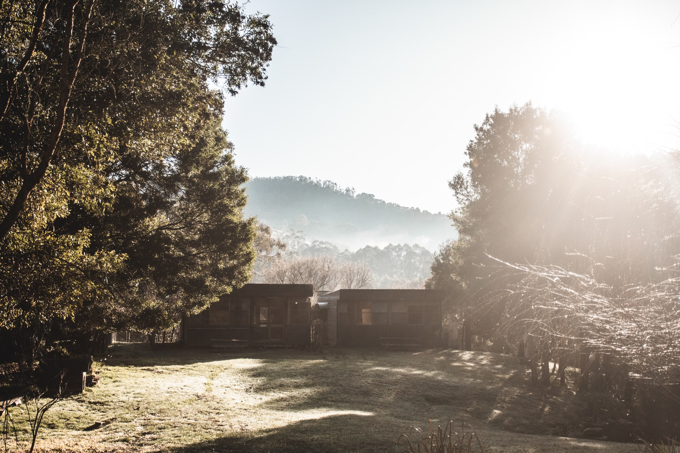 Morning fog rising over the cottages