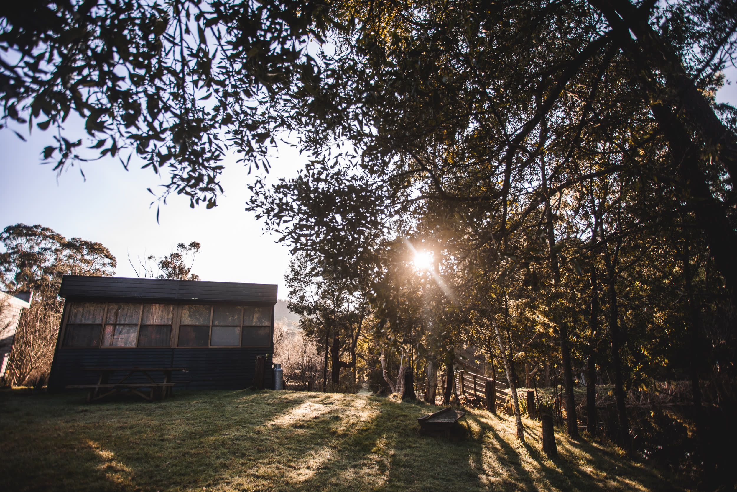 The sun rising over the cottage