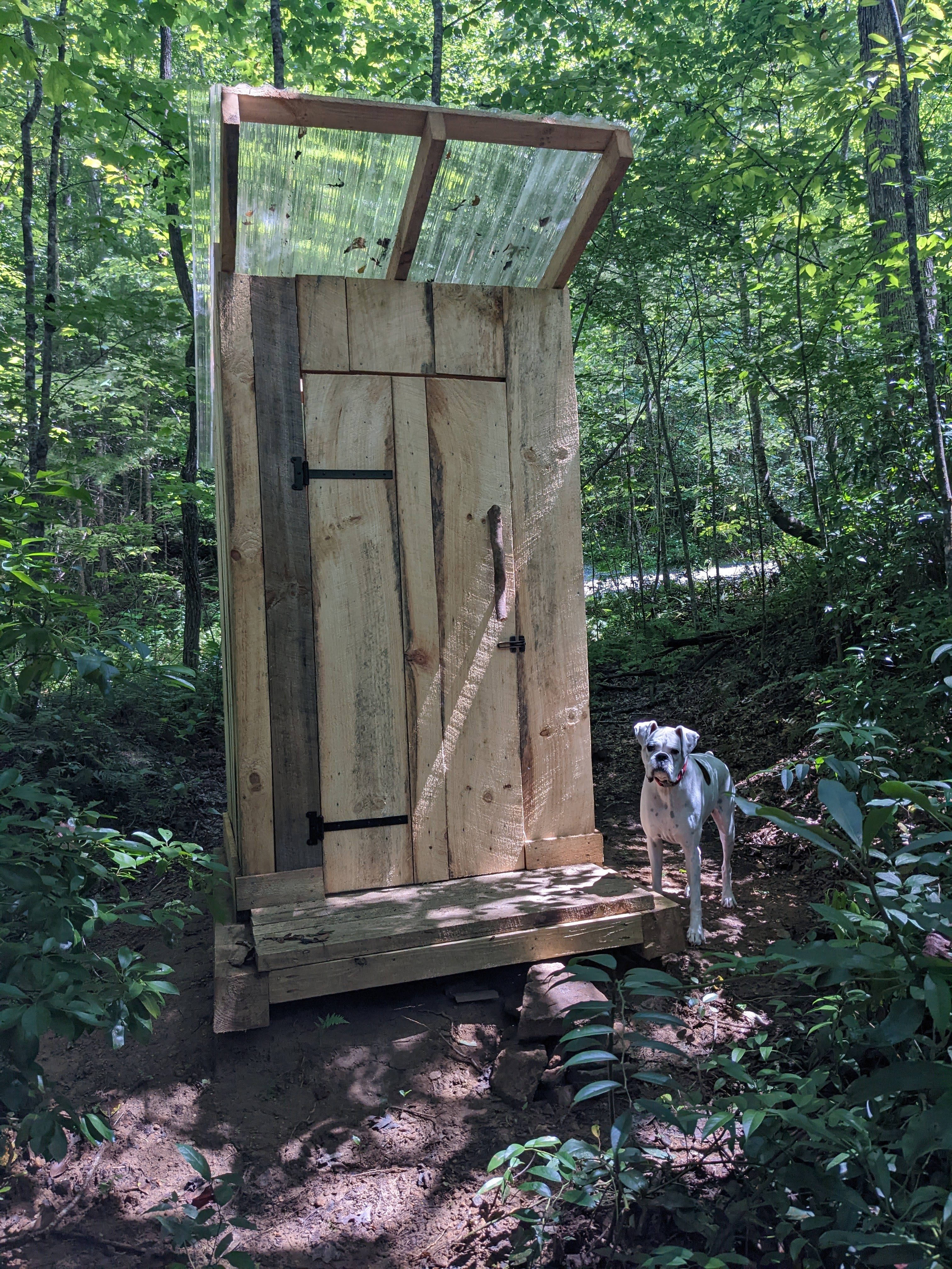 Pit latrine near parking area