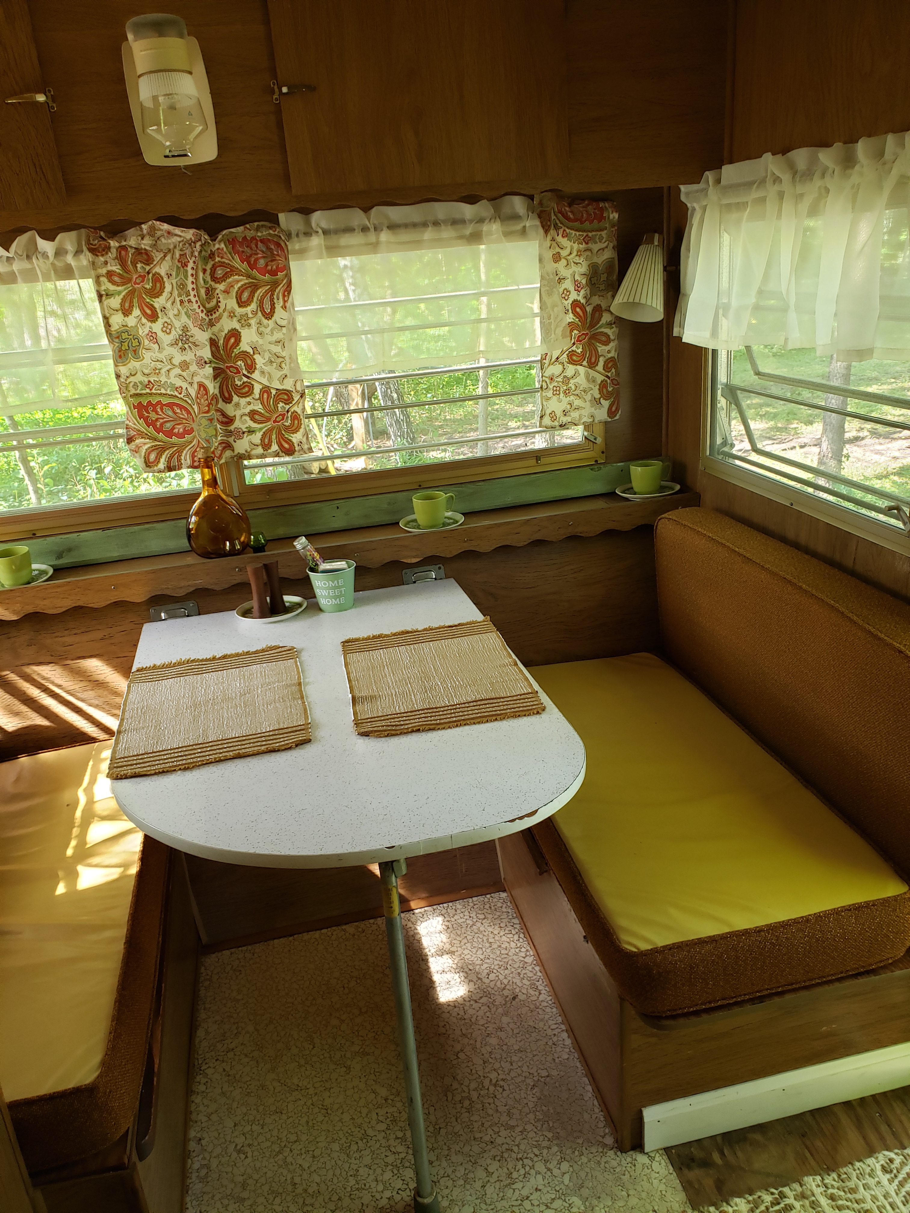 Kitchen table does fold down to a extra bed sheets and blankets provided.