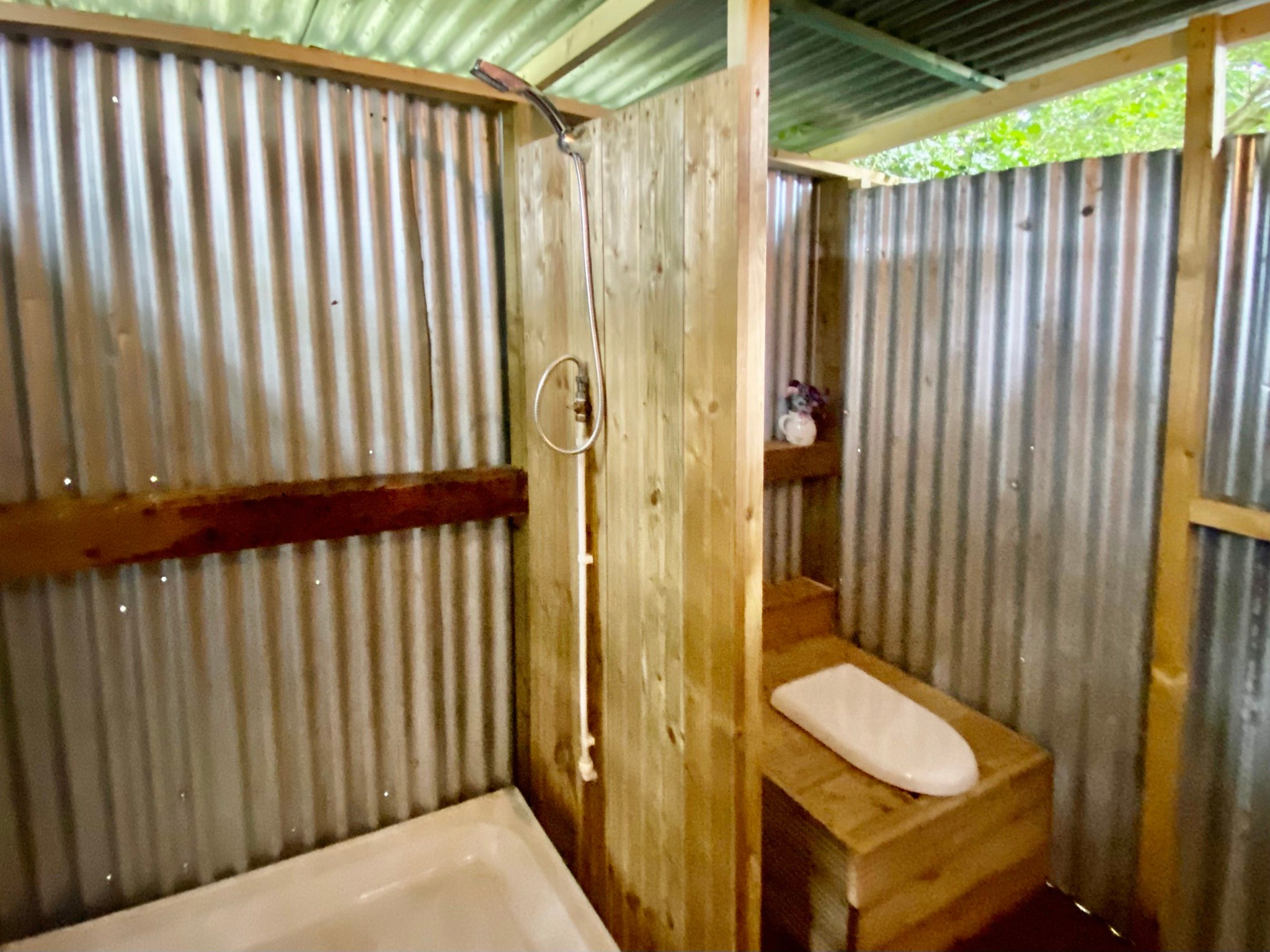 Bathroom is outdoor . Hot shower and compost toilet. 