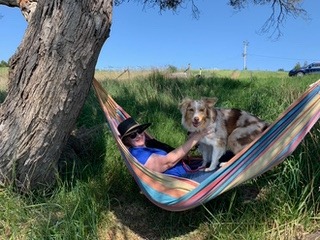 A hammock beside the river.