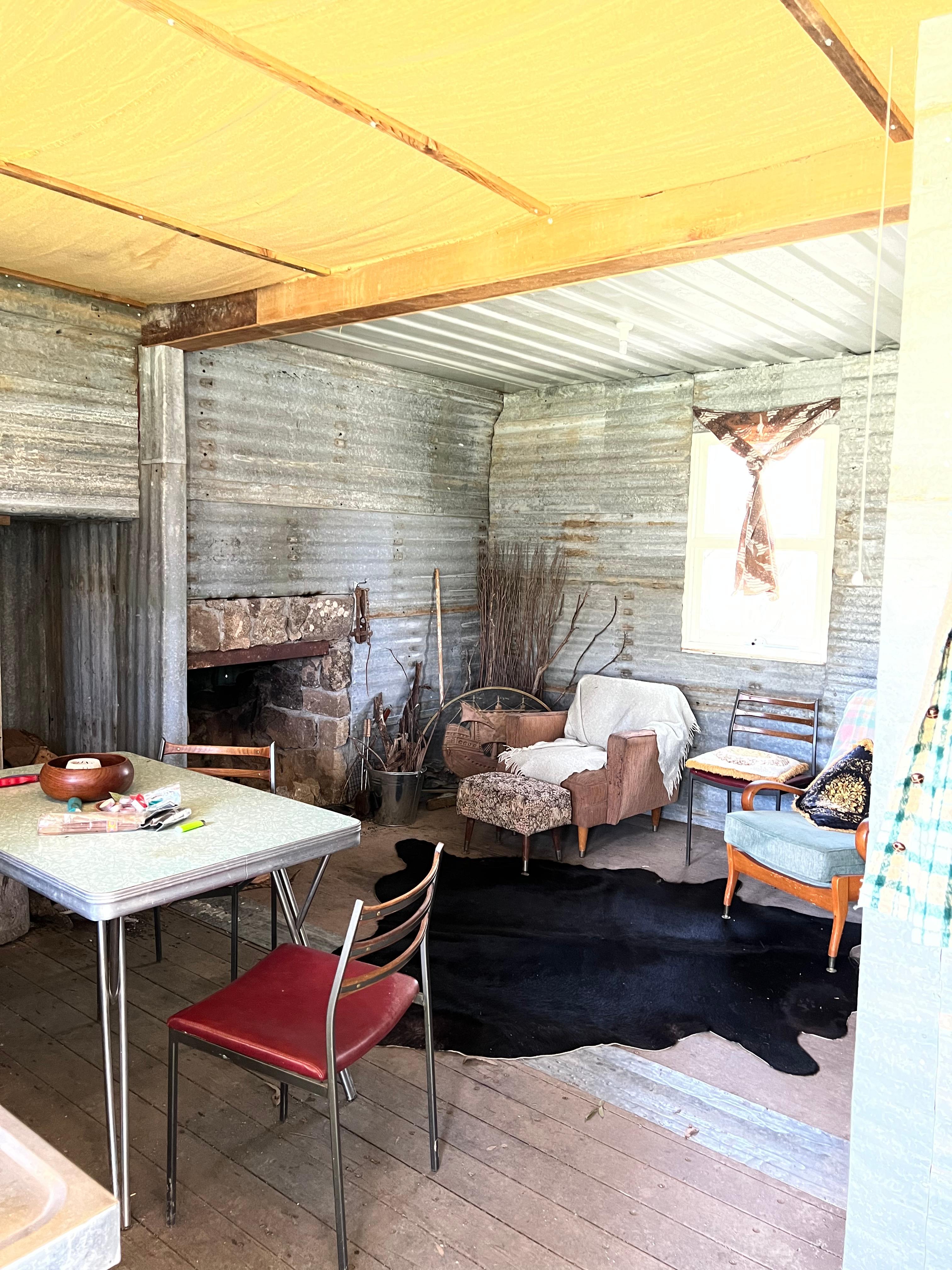 Living area with open fire place.