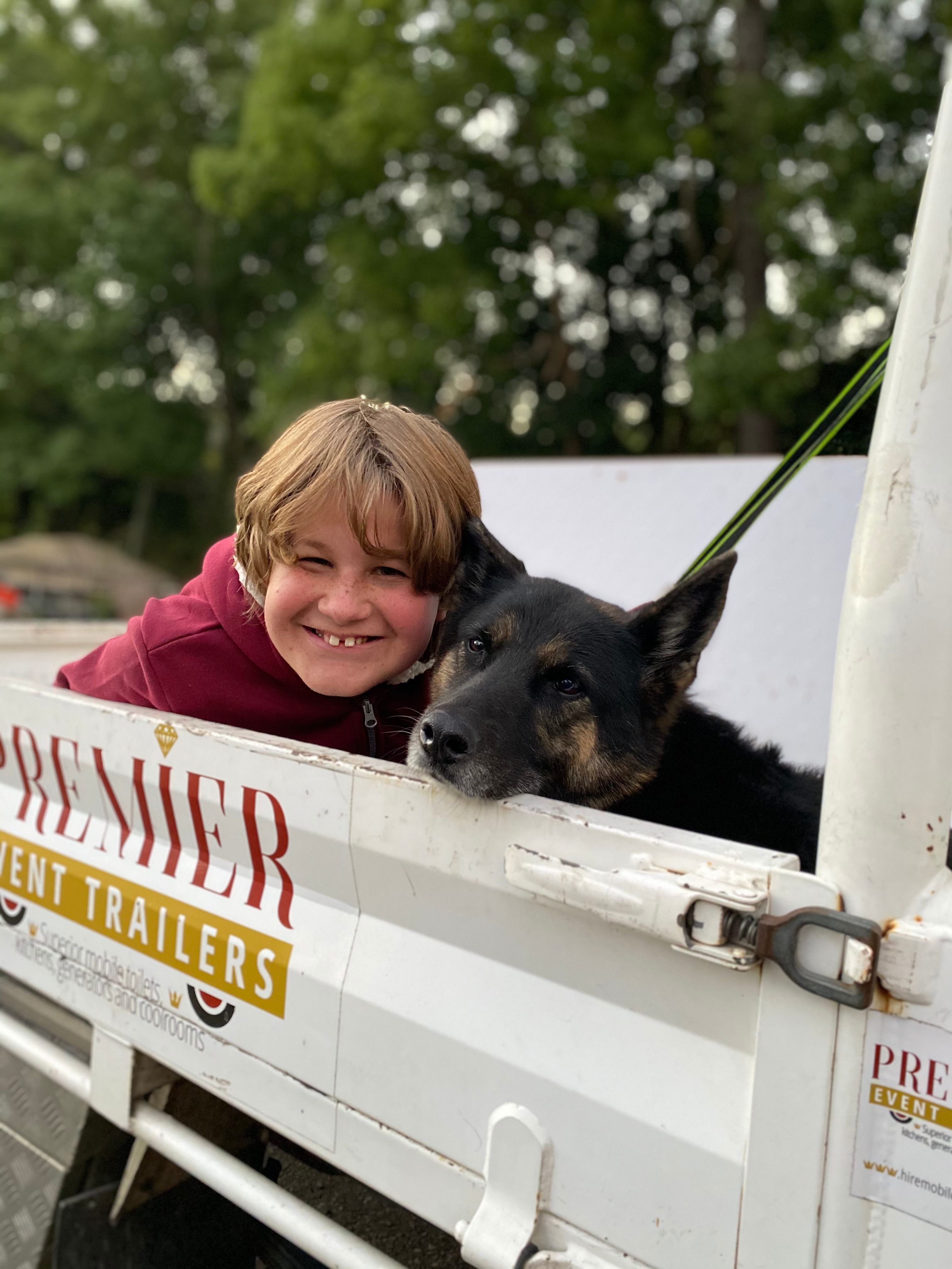 Kids and dogs in utes having time to hang out.