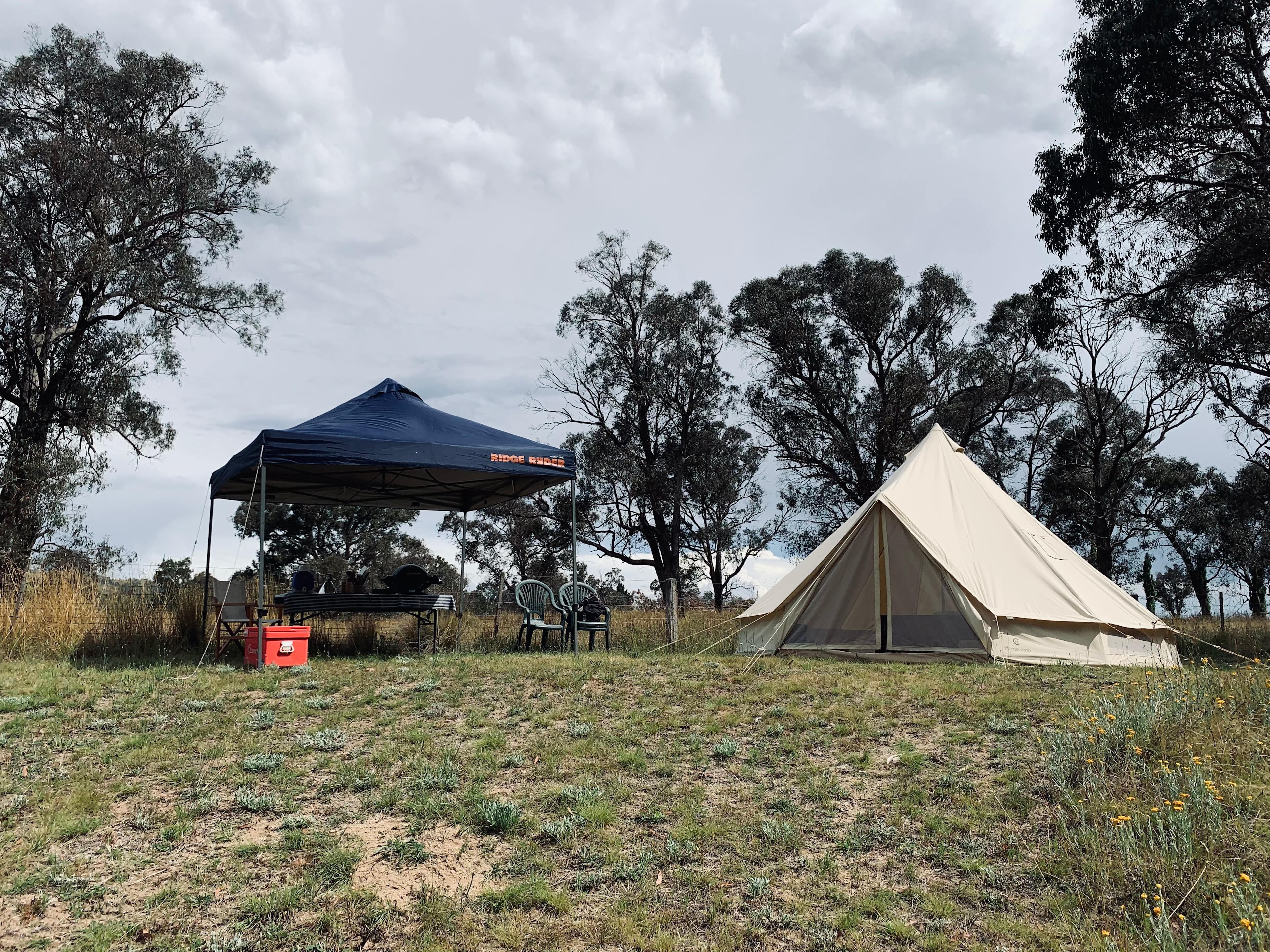 5m canvas bell tent and gazebo shelter with chairs, BBQ, table and 70L esky.