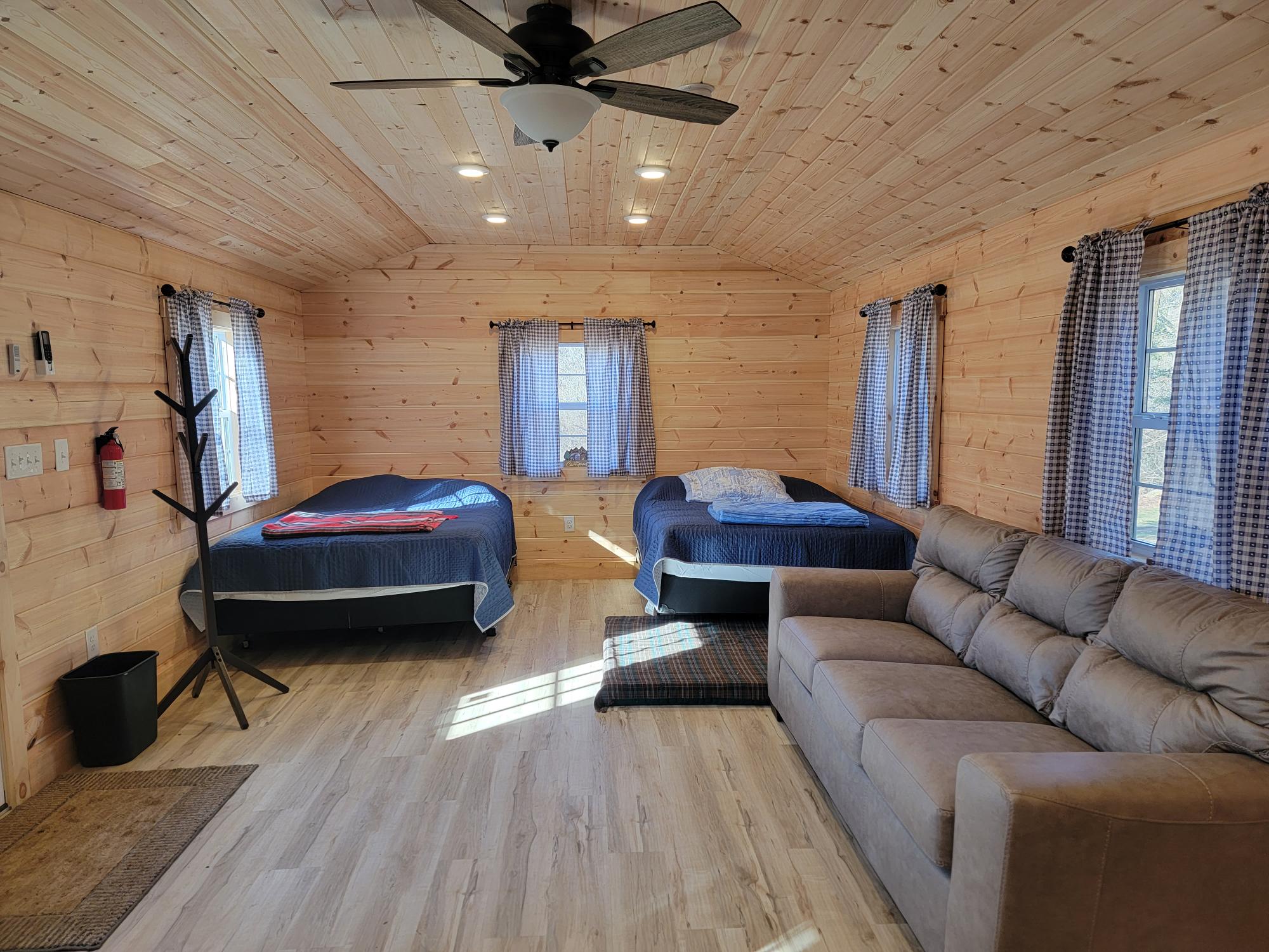
Jake's Bunkhouse at Glamping Clear Spring Maryland 3-Cabin Campground
4 queen size beds, a couch, a chair and heat/AC.