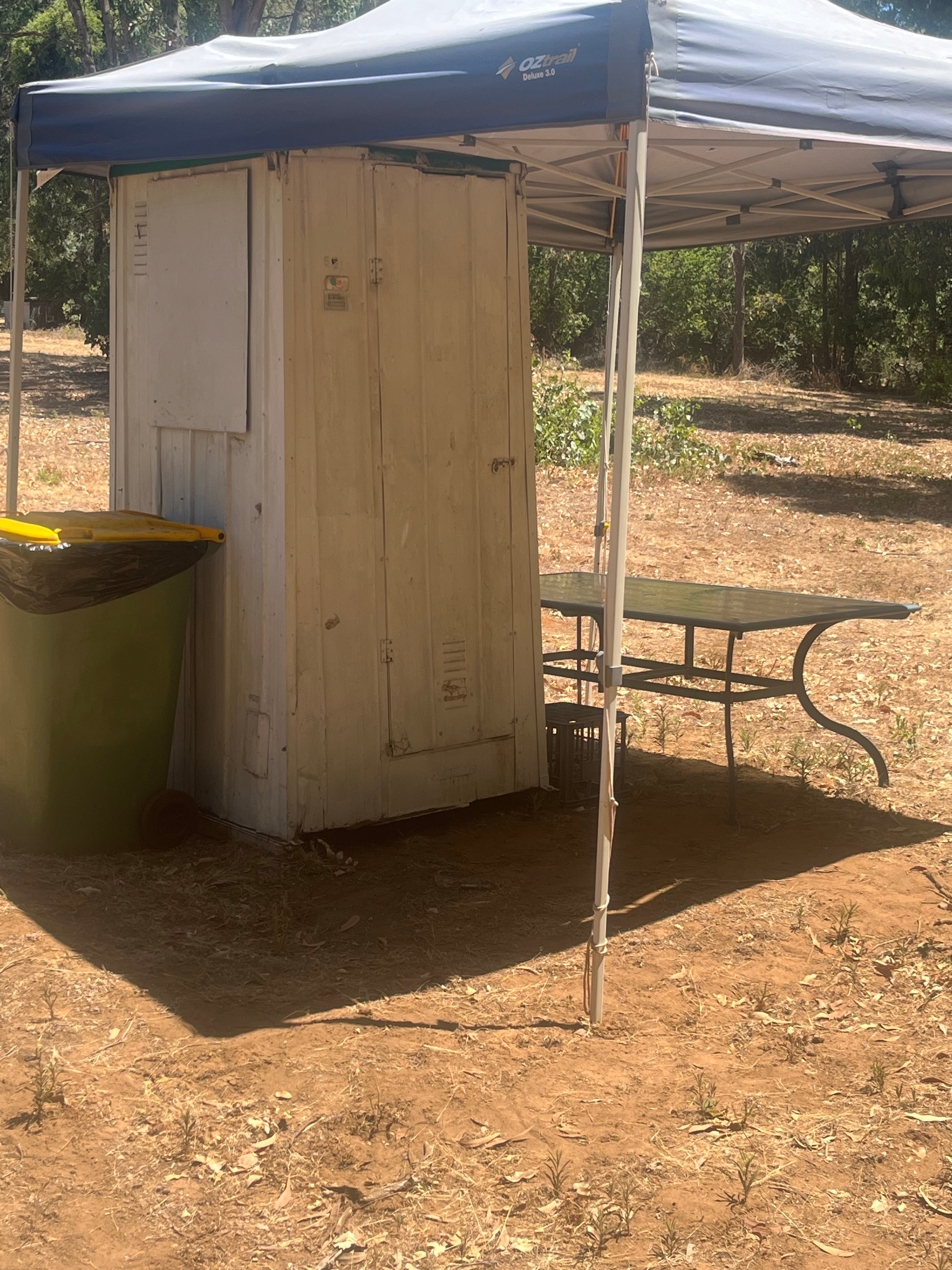 The site loo is just for you and gets a good thorough antibacterial clean out between guests. 
We gave it a bit of afternoon shade to help keep the sweat factor down...
Youll see the table there in the shade too, feel free to move it around to suit your needs. This is an old pic, it now has more privacy now and some solar lighting.
Under no circumstances are tanks from buses or vans to be emptied into this loo! There are free purpose-built dump points available 5 mins south and 10 mins north. Please utilize these, thank you.