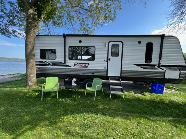 Equipped with Propane BBQ and lawn chairs/loungers and table.  Chairs for deck in the storage compartment
