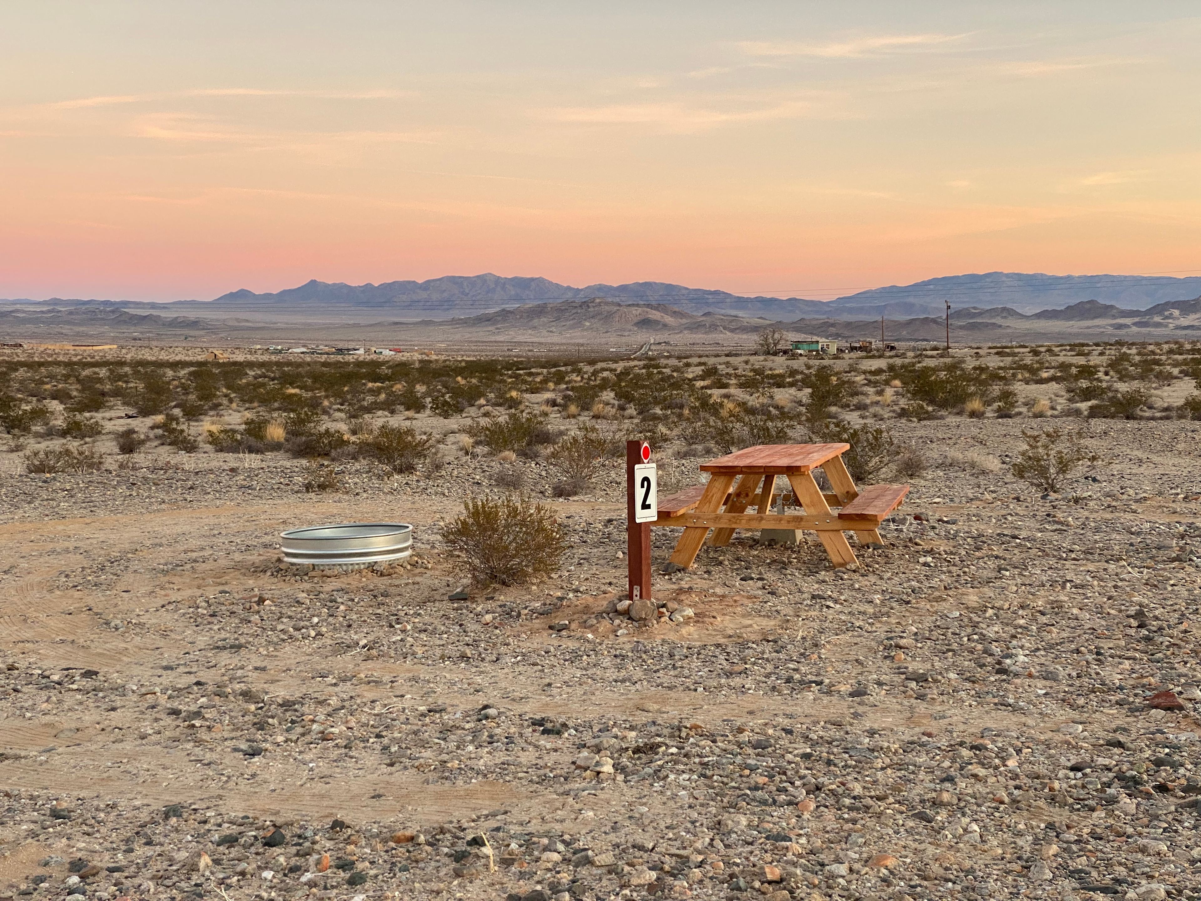 Each site is designed to have the vehicle park on the West side of the campsite so that the vehicle can block the prevailing west winds that kick up once a week.