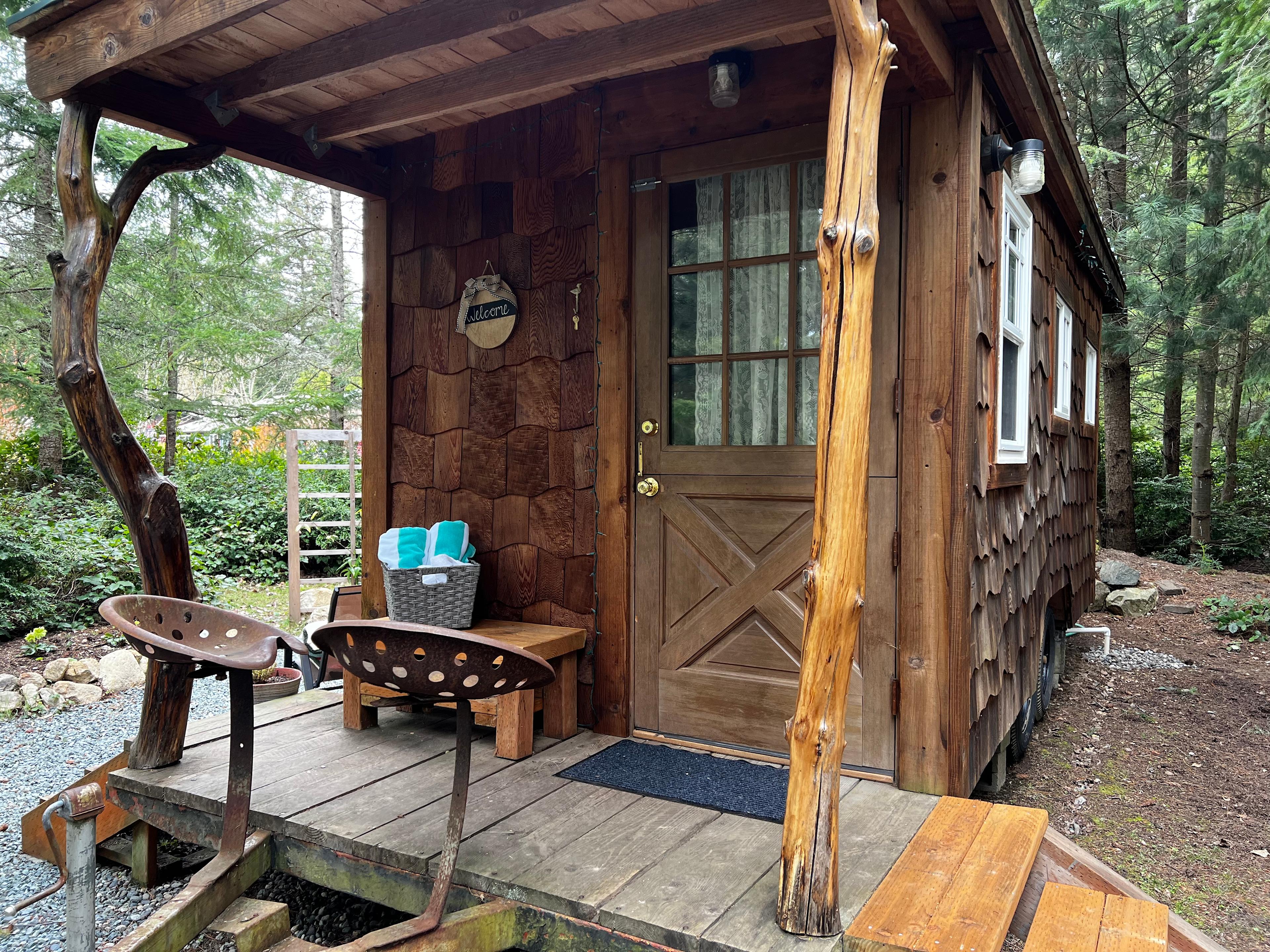 Covered porch entrance with steps to both sides