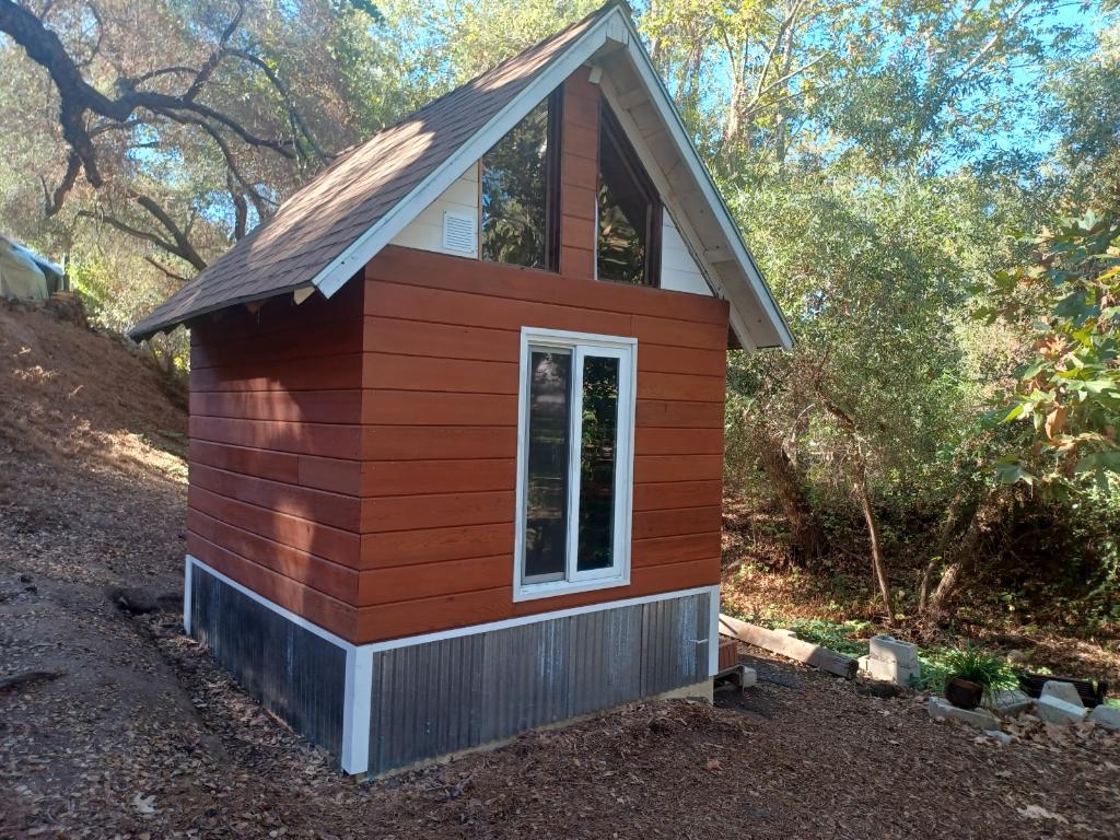 Our little cabin equipped with a comfy queen bed 