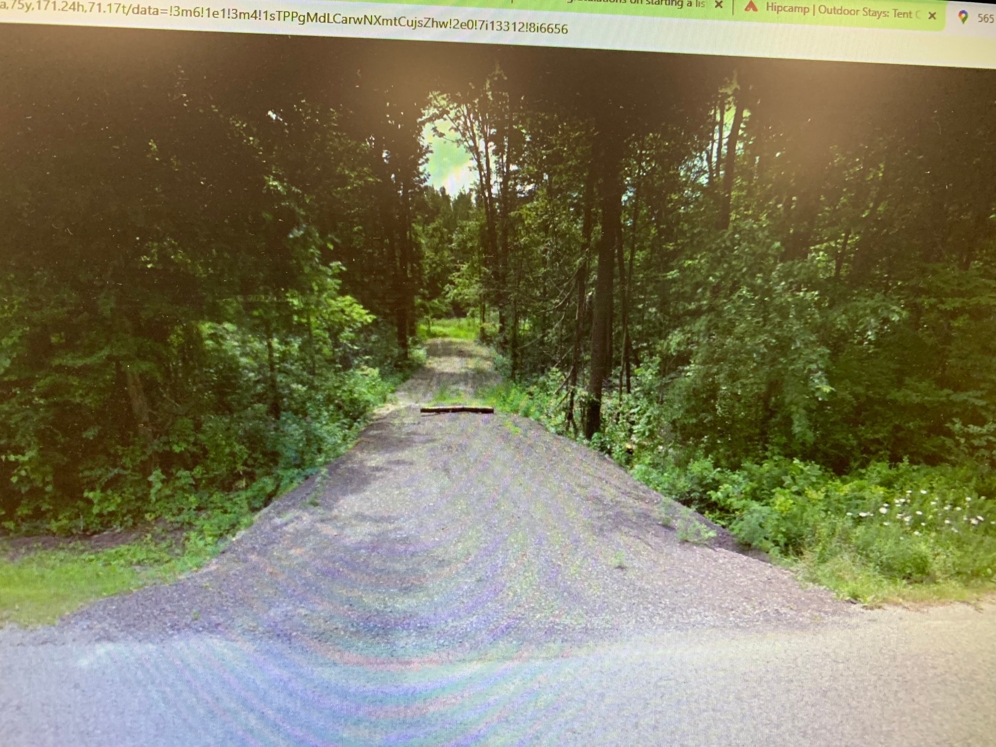 This is a view from the road.  The log across the private driveway is not there.